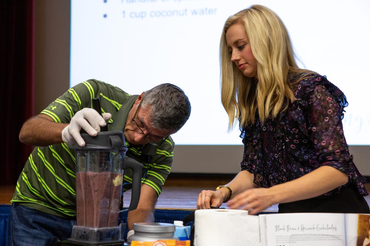 Carly Paige, right, an integrative nutrition health coach and chef, along with help from a Kennedy Space Center employee, demonstrates how to make a smoothie during a presentation inside the Training Auditorium on March 5, 2020. The presentation, led by Paige, was offered during the center’s annual Safety and Health Days, which took place March 2 through March 6. Throughout the week, Kennedy employees had the opportunity to attend a variety of presentations – all of which focused on how to maintain a safe and healthy workforce. Paige’s presentation included information on simple swaps that can be made to incorporate healthier habits on a daily basis.