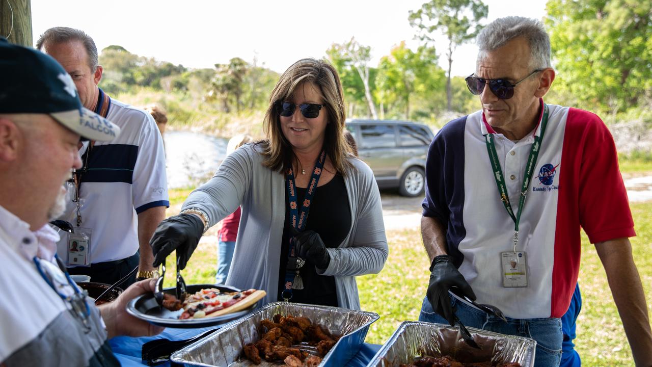 Jennifer Kunz, center, director of Safety and Mission Assurance, and Bob Mott, right, chief of the Commercial Systems Division in the Engineering Directorate at NASA’s Kennedy Space Center in Florida, serve food to Kennedy employees during a Safety and Health Days celebration on March 5, 2020. Taking place March 2 through March 6, Safety and Health Days provides Kennedy employees with a variety of presentations to attend – all of which focus on how to maintain a safe and healthy workforce. The celebration on March 5 took place at the Florida spaceport’s KARS Park II and was open for all employees to attend.
