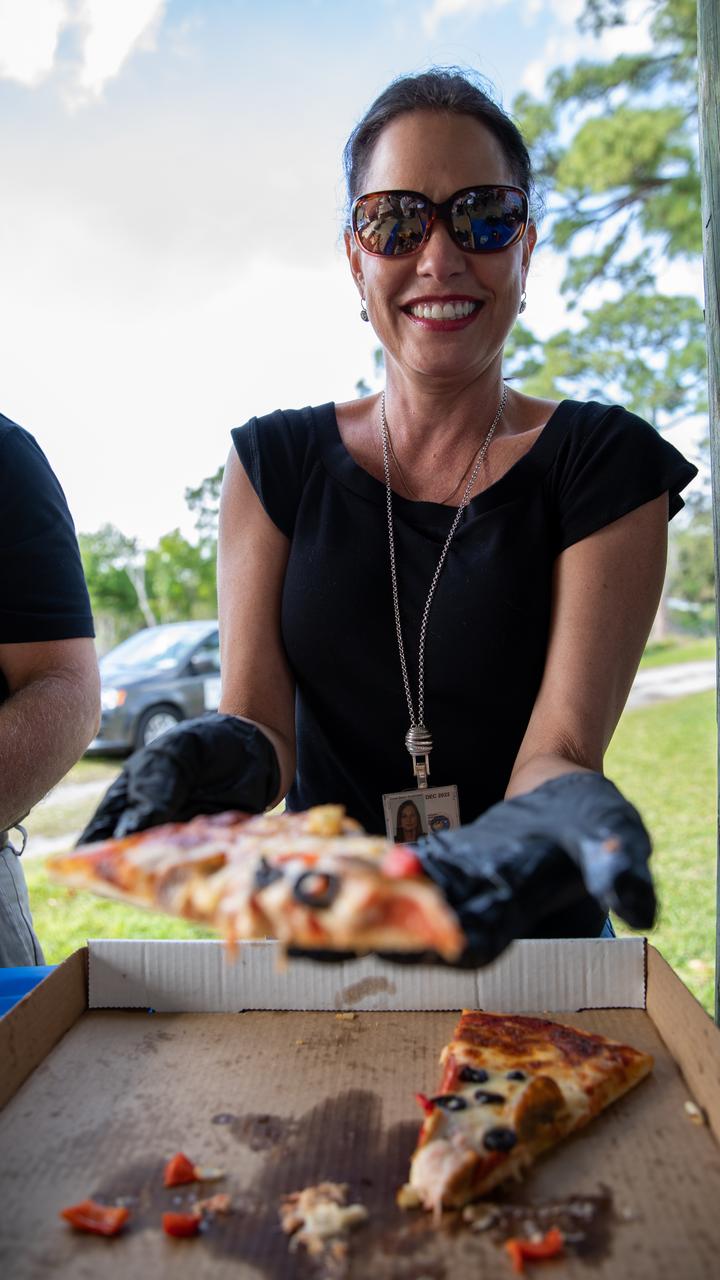 Maria Collura, deputy director of Spaceport Services and Integration at NASA’s Kennedy Space Center in Florida, is photographed serving pizza to Kennedy employees during a Safety and Health Days celebration at the spaceport’s KARS Park II on March 5, 2020. Taking place March 2 through March 6, Safety and Health Days provides Kennedy employees with a variety of presentations to attend – all of which focus on how to maintain a safe and healthy workforce.