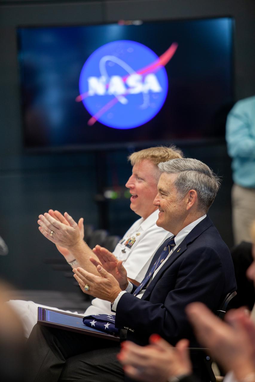 Kennedy Space Center Director Bob Cabana, left, and Captain Ben Shupp, commanding officer, Naval Ordnance Test Unit, enjoy a performance by the U.S. Naval Academy Glee Club at the Florida spaceport on March 10, 2020. As part of the special celebration, Cabana discussed the deep historical ties between NASA and the U.S. Navy. The highly acclaimed Glee Club has achieved prominence as one of America’s premier choral ensembles, performing throughout the nation each year.