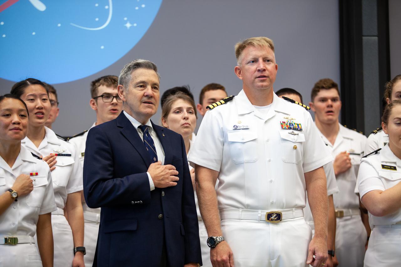 Kennedy Space Center Director Bob Cabana, left, and Captain Ben Shupp, commanding officer, Naval Ordnance Test Unit, stand with the U.S. Naval Academy Glee Club at the Florida spaceport on March 10, 2020. As part of the special celebration, Cabana discussed the deep historical ties between NASA and the U.S. Navy. The highly acclaimed Glee Club has achieved prominence as one of America’s premier choral ensembles, performing throughout the nation each year.