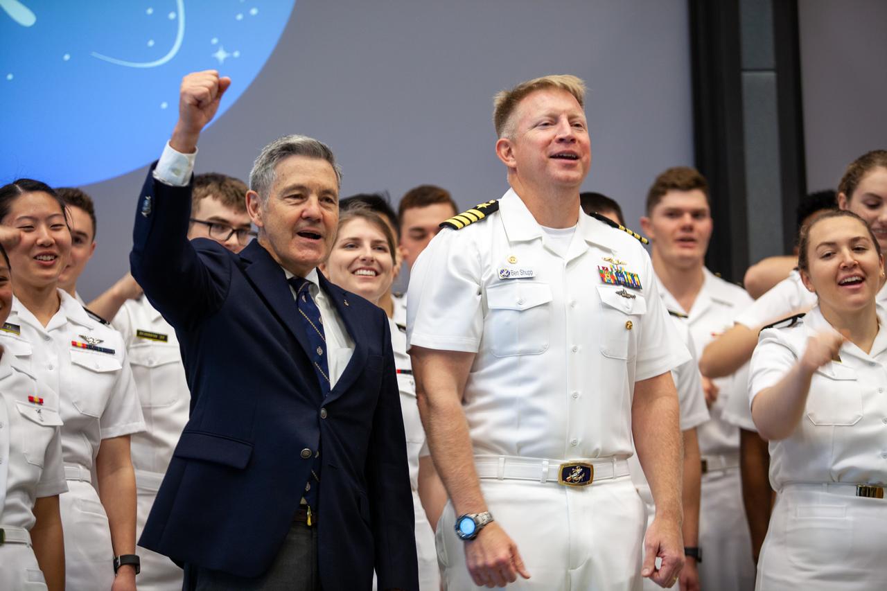 Kennedy Space Center Director Bob Cabana, left, and Captain Ben Shupp, commanding officer, Naval Ordnance Test Unit, stand with the U.S. Naval Academy Glee Club at the Florida spaceport on March 10, 2020. As part of the special celebration, Cabana discussed the deep historical ties between NASA and the U.S. Navy. The highly acclaimed Glee Club has achieved prominence as one of America’s premier choral ensembles, performing throughout the nation each year.