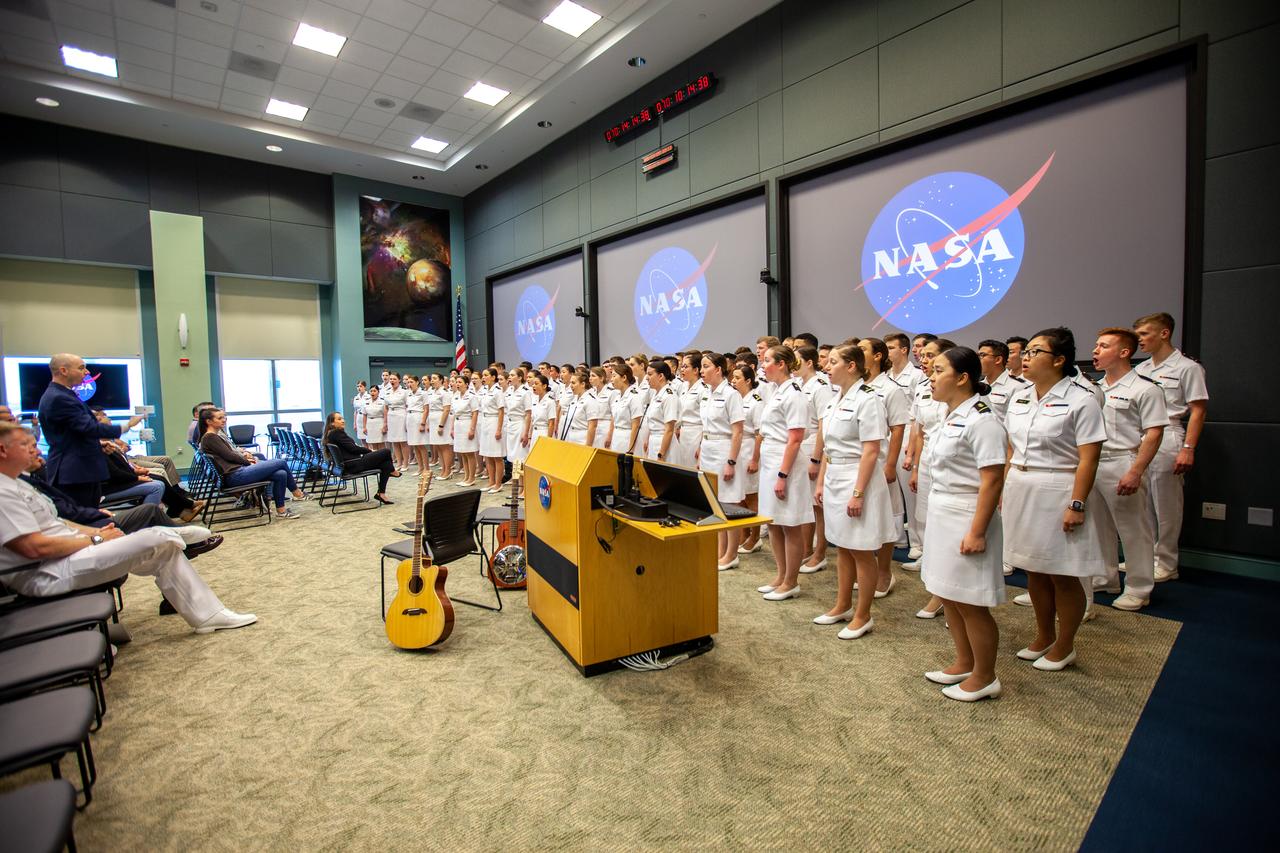 The United States Naval Academy Glee Club performs for Kennedy Space Center employees at the Florida spaceport on March 10, 2020. As part of the celebration, Kennedy Director Bob Cabana discussed the deep historical ties between NASA and the U.S. Navy. The highly acclaimed Glee Club has achieved prominence as one of America’s premier choral ensembles, performing throughout the nation each year.