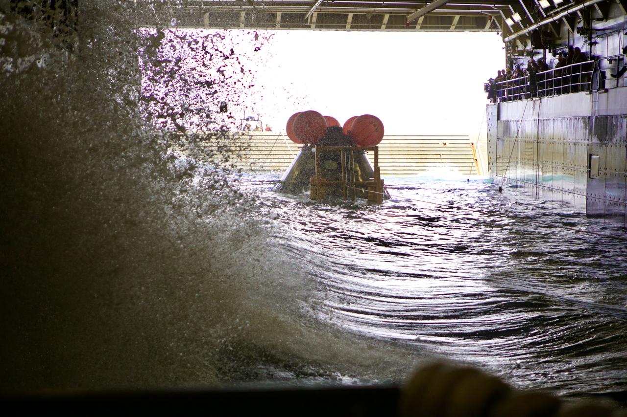 NASA’s Landing and Recovery team practice bringing a test version of the Orion capsule into the well deck of a Navy ship during Underway Recovery Test-8. During the test, the team practiced to ensure recovery procedure timelines are validated as NASA plans to send Artemis I around the Moon and splashdown in the Pacific Ocean.