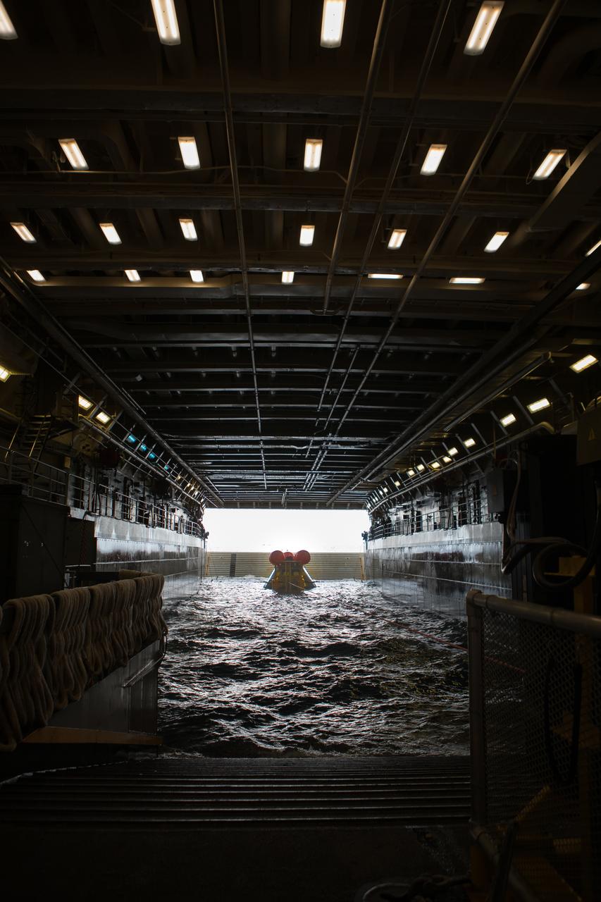 A test version of Orion sits nestled in its cradle during Underway Recovery Test-8 off the coast of California. During the test, the team practiced to ensure recovery procedure timelines are validated as NASA plans to send Artemis I around the Moon and splashdown in the Pacific Ocean.