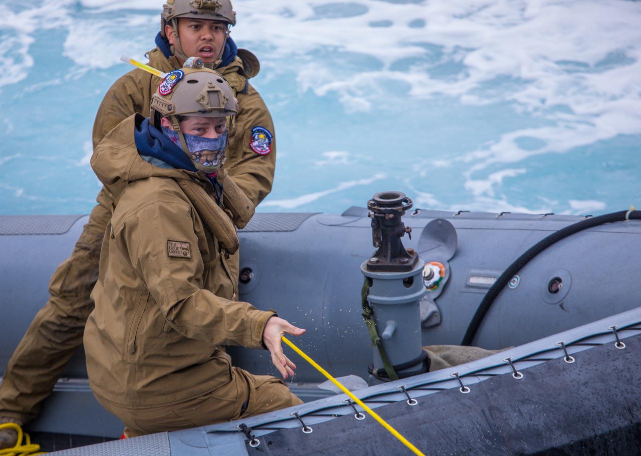 During the first full mission profile test of the recovery procedures for Artemis I, NASA’s Landing and Recovery team met their objectives. The team works with members of the DoD to hone their procedures before Orion splashes down in the Pacific as part of NASA’s Artemis program. During Underway Recovery Test-8, two divers from EOD Mobile Unit 3, MDS Company 3-1 work the tending line while a test version of Orion is being pulled into the well deck of the USS John P. Murtha.