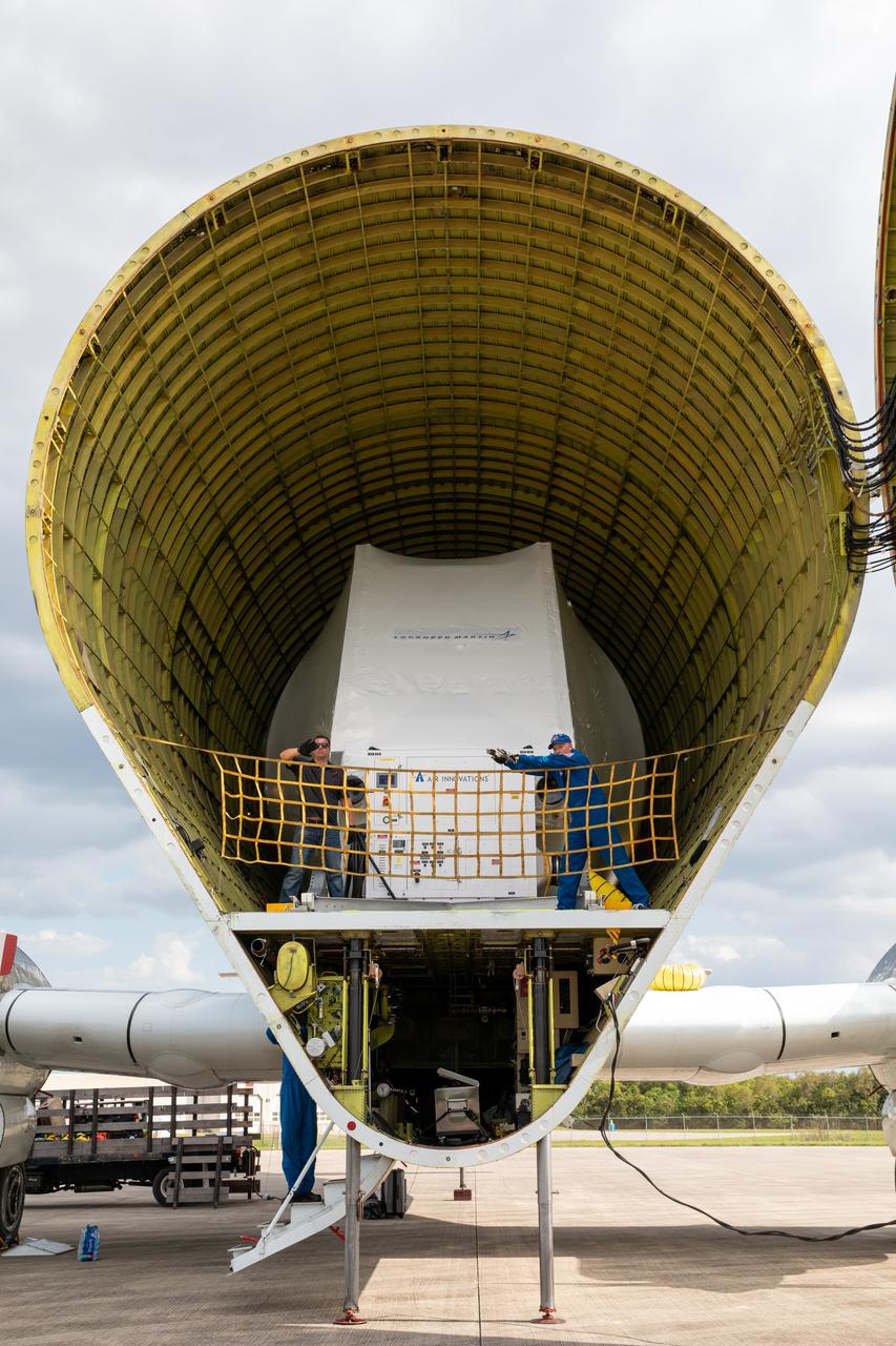 NASA’s Orion spacecraft, protected in its shipping container, is removed from the agency’s Super Guppy aircraft at the Launch and Landing Facility runway at Kennedy Space Center on March 25, 2020, for transportation to the Neil Armstrong Operations and Checkout Building. After testing at NASA’s Plum Brook Station in Ohio verified it can handle the extreme conditions of a deep-space environment, the spacecraft has returned to the Florida spaceport for final testing and assembly. Following this, it will be integrated with the Space Launch System rocket for Artemis I – the first in a series of increasingly complex missions to the Moon that will ultimately lead to the exploration of Mars.