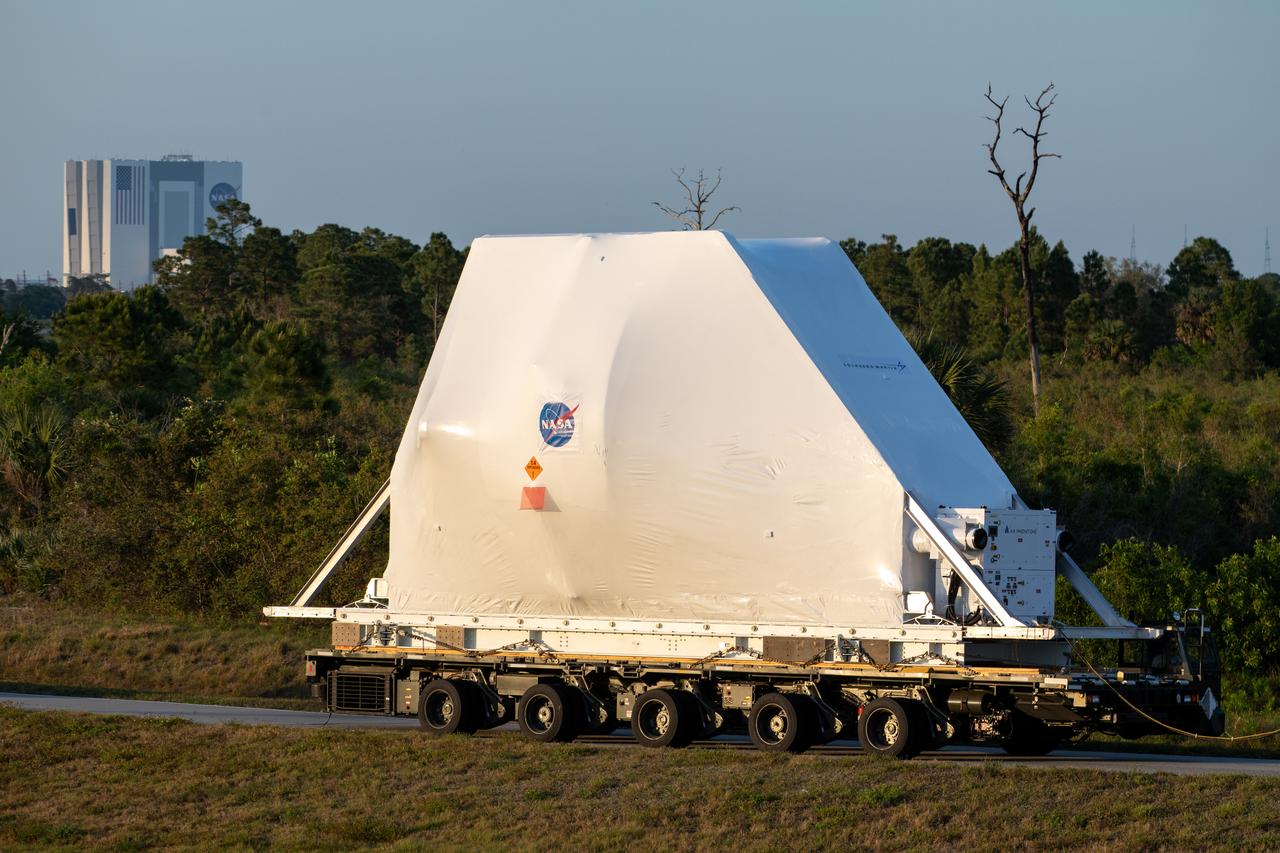 NASA’s Orion spacecraft, protected in its shipping container, is loaded onto a transporter at the Launch and Landing Facility at Kennedy Space Center for its move to the Neil Armstrong Operations and Checkout Building on March 25, 2020. After testing at NASA’s Plum Brook Station in Ohio verified it can handle the extreme conditions of a deep-space environment, the spacecraft – carried by the agency’s Super Guppy aircraft – has returned to the Florida spaceport for final testing and assembly. Following this, Orion will be integrated with the Space Launch System rocket for Artemis I – the first in a series of increasingly complex missions to the Moon that will ultimately lead to the exploration of Mars.