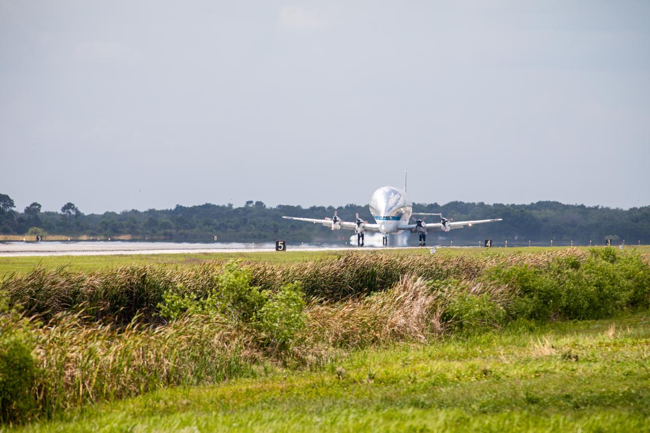NASA’s Super Guppy aircraft, carrying the Orion spacecraft, touches down at the Launch and Landing Facility at the agency’s Kennedy Space Center in Florida on March 25, 2020. The container holding Orion can be seen in the open aircraft. The spacecraft was transported from NASA’s Plum Brook Station in Ohio, where it underwent two phases of testing to demonstrate it can handle the extreme conditions of a deep-space environment. The container will be offloaded and secured onto a transporter for its move to the Neil Armstrong Operations and Checkout Building for final testing and assembly. Following this, Orion will be integrated with the Space Launch System rocket for Artemis I – the first in a series of increasingly complex missions to the Moon that will ultimately lead to the exploration of Mars.