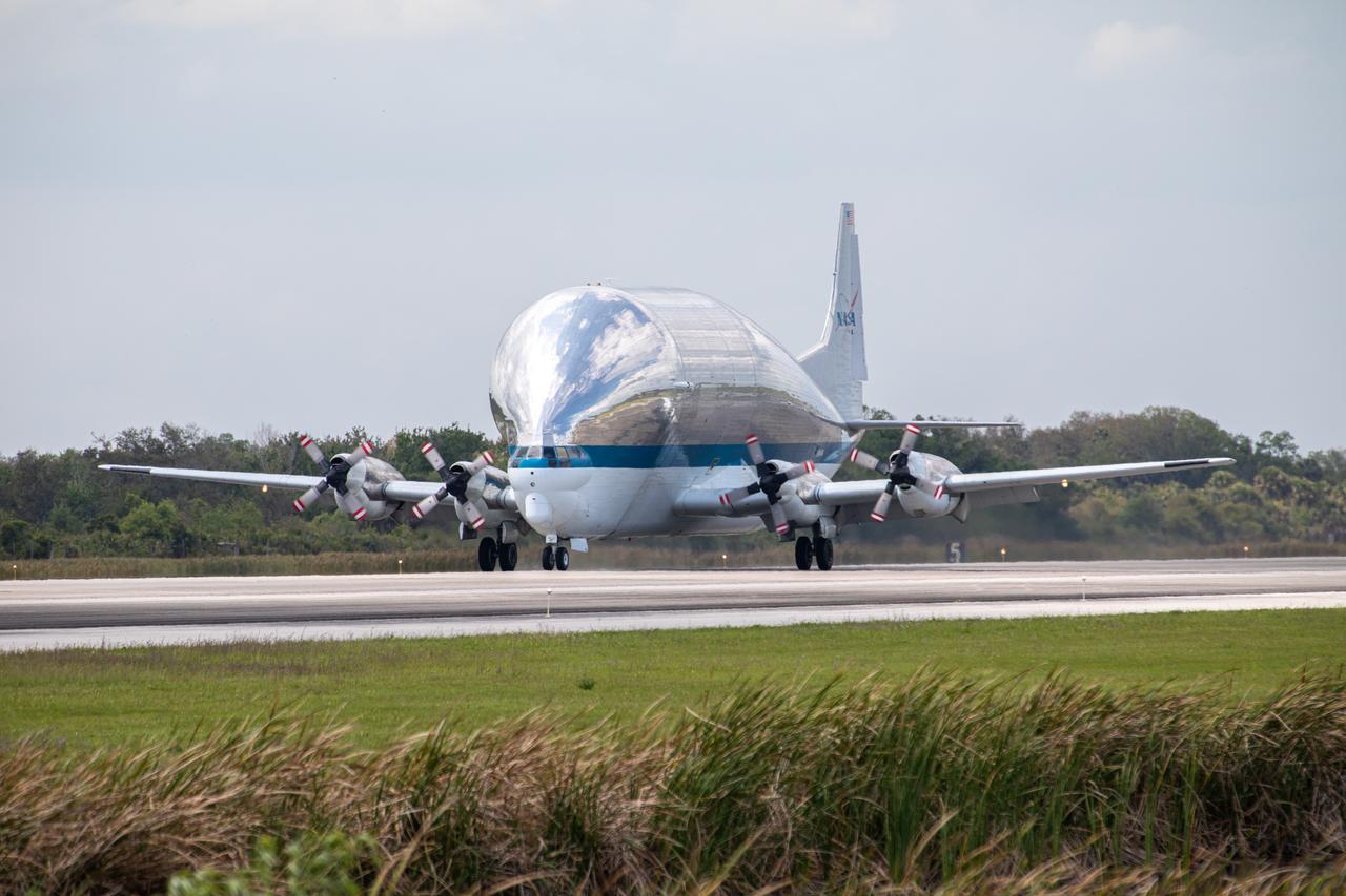 NASA’s Super Guppy aircraft, carrying the Orion spacecraft, lands at the Launch and Landing Facility runway at Kennedy Space Center in Florida on March 25, 2020. Orion has returned to Kennedy after testing at the agency’s Plum Brook Station in Ohio verified the spacecraft can handle the extreme conditions of a deep-space environment. The spacecraft will now undergo final testing and assembly prior to being integrated with the Space Launch System rocket. Orion will fly on the agency’s Artemis I mission – the first in a series of increasingly complex missions to the Moon that will ultimately lead to the exploration of Mars.