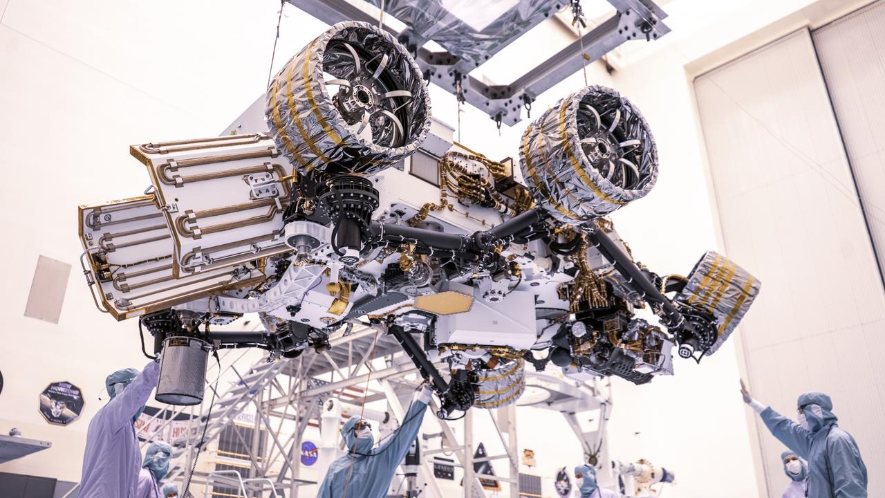 Engineers perform mass properties testing on NASA’s Mars Perseverance rover inside Kennedy Space Center’s Payload Hazardous Servicing Facility on April 7, 2020. The rover was rotated clockwise and counterclockwise on a spin table to determine the center of gravity, or the point at which weight is evenly dispersed on all sides. Establishing the rover’s center of gravity will help ensure the spacecraft will land on Mars as calculated. Perseverance will touch down on the Red Planet on Feb. 18, 2021. Liftoff aboard a United Launch Alliance Atlas V 541 rocket is targeted between July 17 and Aug. 5 from Cape Canaveral Air Force Station. NASA’s Launch Services Program based at Kennedy is managing the launch.