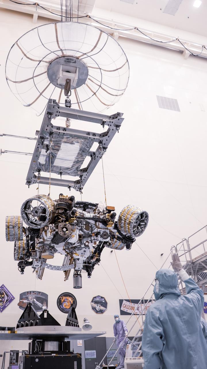 Engineers perform mass properties testing on NASA’s Mars Perseverance rover inside Kennedy Space Center’s Payload Hazardous Servicing Facility on April 7, 2020. The rover was rotated clockwise and counterclockwise on a spin table to determine the center of gravity, or the point at which weight is evenly dispersed on all sides. Establishing the rover’s center of gravity will help ensure the spacecraft will land on Mars as calculated. Perseverance will touch down on the Red Planet on Feb. 18, 2021. Liftoff aboard a United Launch Alliance Atlas V 541 rocket is targeted between July 17 and Aug. 5 from Cape Canaveral Air Force Station. NASA’s Launch Services Program based at Kennedy is managing the launch.