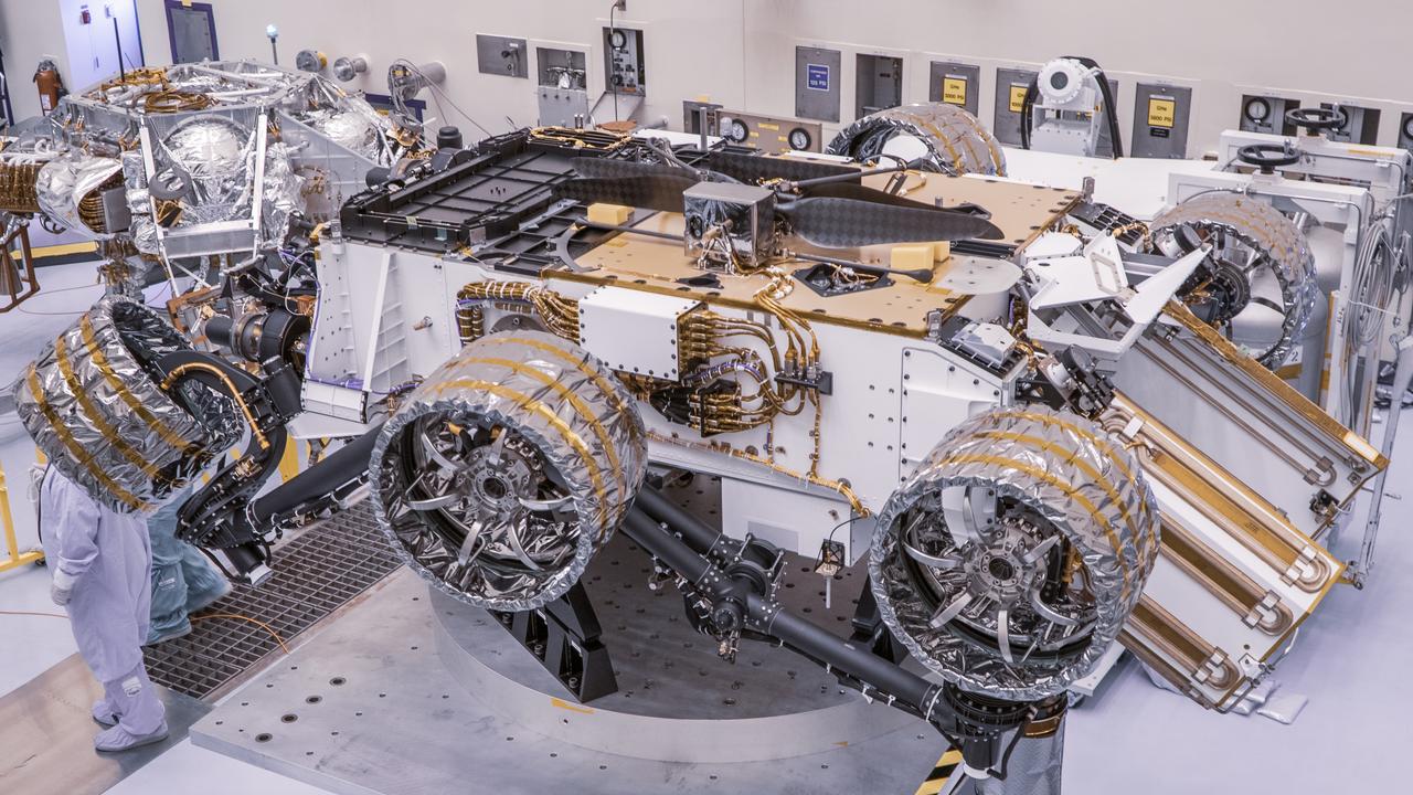 Engineers perform mass properties testing on NASA’s Mars Perseverance rover inside Kennedy Space Center’s Payload Hazardous Servicing Facility on April 7, 2020. The rover was rotated clockwise and counterclockwise on a spin table to determine the center of gravity, or the point at which weight is evenly dispersed on all sides. Establishing the rover’s center of gravity will help ensure the spacecraft will land on Mars as calculated. Perseverance will touch down on the Red Planet on Feb. 18, 2021. Liftoff aboard a United Launch Alliance Atlas V 541 rocket is targeted between July 17 and Aug. 5 from Cape Canaveral Air Force Station. NASA’s Launch Services Program based at Kennedy is managing the launch.