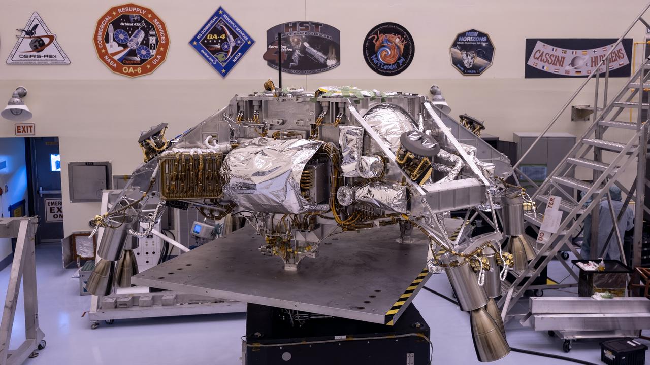 Engineers perform mass properties testing on the rocket-powered descent stage of NASA’s Mars Perseverance rover at Kennedy Space Center on April 12, 2020. The testing to determine the center of gravity, or the point at which weight is evenly dispersed on all sides, was performed inside the Florida spaceport’s Payload Hazardous Servicing Facility. The descent stage will lower the rover through the thin Martian atmosphere and onto the surface on Feb. 18, 2021. Liftoff, aboard a United Launch Alliance Atlas V 541 rocket, is targeted between July 17 and Aug. 5 from Cape Canaveral Air Force Station. NASA’s Launch Services Program based at Kennedy is managing the launch. The rover will seek signs of ancient life and collect rock and soil samples for possible return to Earth.