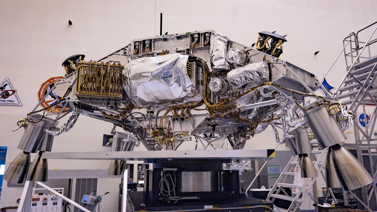Engineers perform mass properties testing on the rocket-powered descent stage of NASA’s Mars Perseverance rover at Kennedy Space Center on April 12, 2020. The testing to determine the center of gravity, or the point at which weight is evenly dispersed on all sides, was performed inside the Florida spaceport’s Payload Hazardous Servicing Facility. The descent stage will lower the rover through the thin Martian atmosphere and onto the surface on Feb. 18, 2021. Liftoff, aboard a United Launch Alliance Atlas V 541 rocket, is targeted between July 17 and Aug. 5 from Cape Canaveral Air Force Station. NASA’s Launch Services Program based at Kennedy is managing the launch. The rover will seek signs of ancient life and collect rock and soil samples for possible return to Earth.