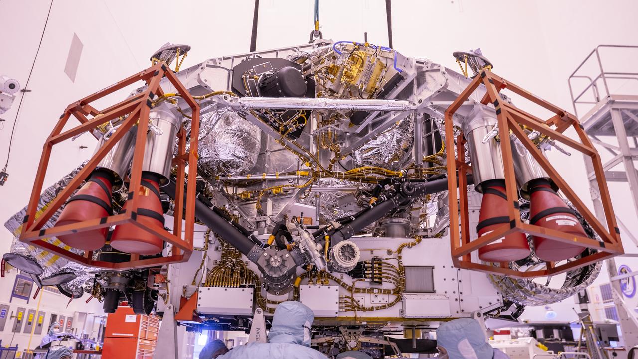 The Mars Perseverance rover is attached to its rocket-powered descent stage inside the Payload Hazardous Servicing Facility at NASA’s Kennedy Space Center in Florida on April 23, 2020. The rover and descent stage are the first spacecraft components to come together for launch — and they will be the last to separate when the spacecraft reaches Mars. At about 65 feet over the Martian surface, separation bolts will fire and the descent stage will lower Perseverance onto the Red Planet. Launch, aboard a United Launch Alliance Atlas V 541 rocket, is targeted between July 17 and Aug. 5 from Cape Canaveral Air Force Station. NASA’s Launch Services Program based at Kennedy is managing the launch.