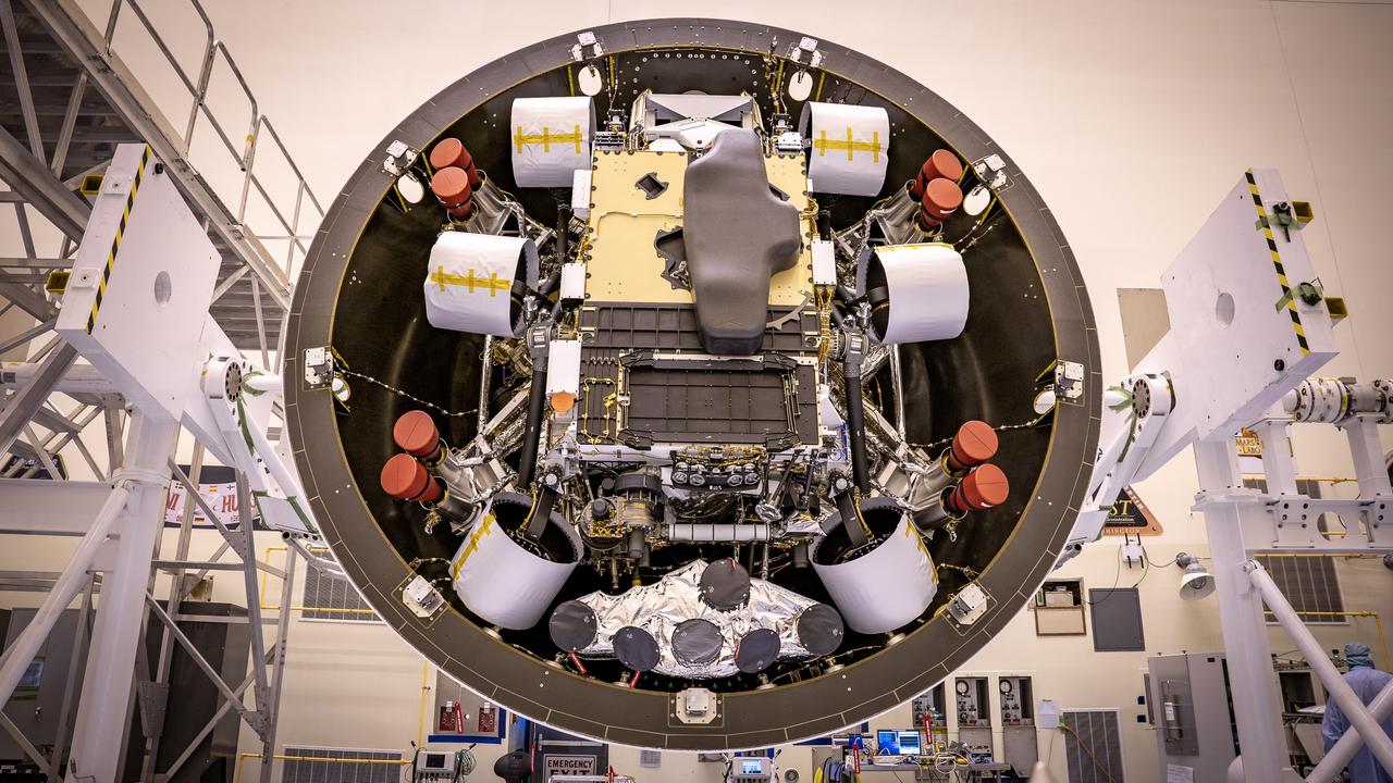 Inside the Payload Hazardous Servicing Facility at NASA’s Kennedy Space Center in Florida, the Backshell-Powered Descent Vehicle and Entry Vehicle assemblies are being prepared to be attached to the Mars Perseverance rover on May 4, 2020. The cone-shaped backshell contains the parachute, and along with the mission’s heat shield, provides protection for the rover and descent stage during Martian atmospheric entry. The Mars Perseverance rover is scheduled to launch in mid-July atop a United Launch Alliance Atlas V 541 rocket from Pad 41 at nearby Cape Canaveral Air Force Station. The rover is part of NASA’s Mars Exploration Program, a long-term effort of robotic exploration of the Red Planet. The rover will search for habitable conditions in the ancient past and signs of past microbial life on Mars. The Launch Services Program at Kennedy is responsible for launch management.