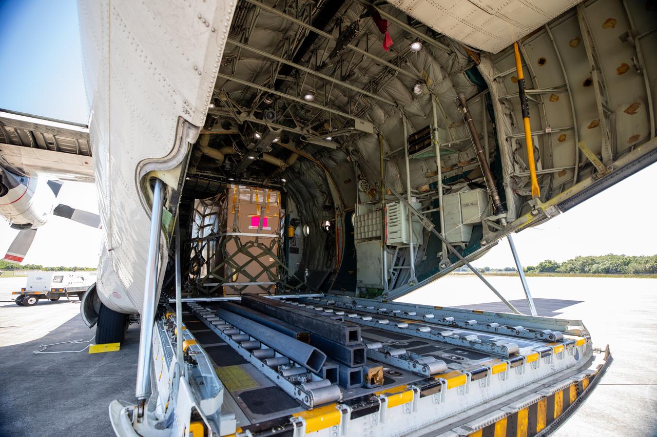 NASA’s C-130 aircraft cargo hold is open for offloading of the Adaptive Caching Assembly (ACA) for NASA’s Mars Perseverance rover at Kennedy Space Center’s Launch and Landing Facility in Florida on May 11, 2020. The ACA consists of seven motors and more than 3,000 parts, all working in unison to collect samples from the surface of Mars. A chief component of the assembly is the Sample Handling Arm, which will move sample tubes to the main robotic arm's coring drill and then transfer the filled sample tubes into a space to be sealed and stored. The Mars Perseverance rover is scheduled to launch in mid-July atop a United Launch Alliance Atlas V 541 rocket from Pad 41 at nearby Cape Canaveral Air Force Station. The rover is part of NASA’s Mars Exploration Program, a long-term effort of robotic exploration of the Red Planet. The rover will search for habitable conditions in the ancient past and signs of past microbial life on Mars. The Launch Services Program at Kennedy is responsible for launch management.