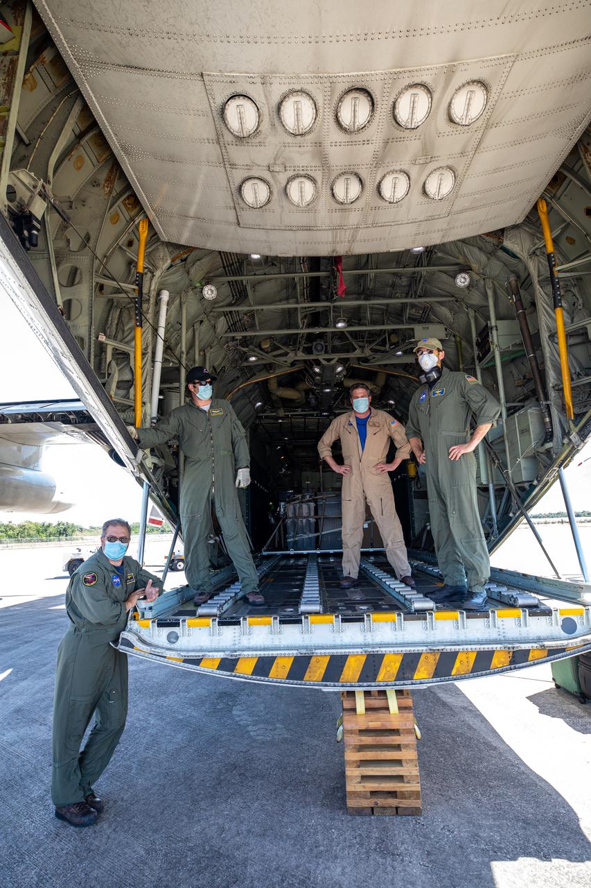 Workers prepare to offload the Adaptive Caching Assembly (ACA) for NASA’s Mars Perseverance rover from the agency’s C-130 aircraft at Kennedy Space Center’s Launch and Landing Facility in Florida on May 11, 2020. The ACA consists of seven motors and more than 3,000 parts, all working in unison to collect samples from the surface of Mars. A chief component of the assembly is the Sample Handling Arm, which will move sample tubes to the main robotic arm's coring drill and then transfer the filled sample tubes into a space to be sealed and stored. The Mars Perseverance rover is scheduled to launch in mid-July atop a United Launch Alliance Atlas V 541 rocket from Pad 41 at nearby Cape Canaveral Air Force Station. The rover is part of NASA’s Mars Exploration Program, a long-term effort of robotic exploration of the Red Planet. The rover will search for habitable conditions in the ancient past and signs of past microbial life on Mars. The Launch Services Program at Kennedy is responsible for launch management. 