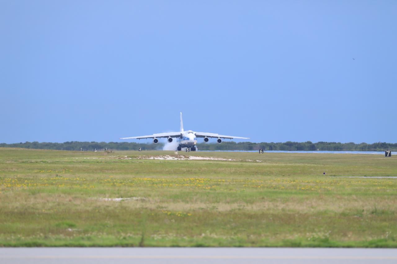 The Antonov 124 cargo aircraft, carrying the United Launch Alliance booster for NASA’s Mars Perseverance rover, touches down on the Skid Strip at Cape Canaveral Air Force Station (CCAFS) in Florida on May 18, 2020. The Mars Perseverance rover is scheduled to launch in mid-July atop a United Launch Alliance Atlas V 541 rocket from Pad 41 at CCAFS. The rover is part of NASA’s Mars Exploration Program, a long-term effort of robotic exploration of the Red Planet. The rover will search for habitable conditions in the ancient past and signs of past microbial life on Mars. The Launch Services Program at Kennedy is responsible for launch management.