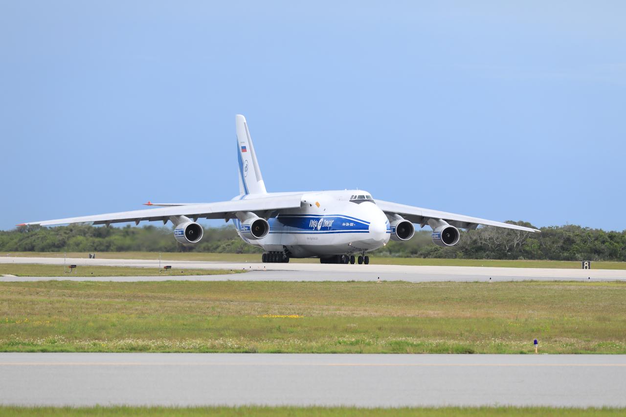 The Antonov 124 cargo aircraft, carrying the United Launch Alliance booster for NASA’s Mars Perseverance rover, touches down on the Skid Strip at Cape Canaveral Air Force Station (CCAFS) in Florida on May 18, 2020. The Mars Perseverance rover is scheduled to launch in mid-July atop a United Launch Alliance Atlas V 541 rocket from Pad 41 at CCAFS. The rover is part of NASA’s Mars Exploration Program, a long-term effort of robotic exploration of the Red Planet. The rover will search for habitable conditions in the ancient past and signs of past microbial life on Mars. The Launch Services Program at Kennedy is responsible for launch management.