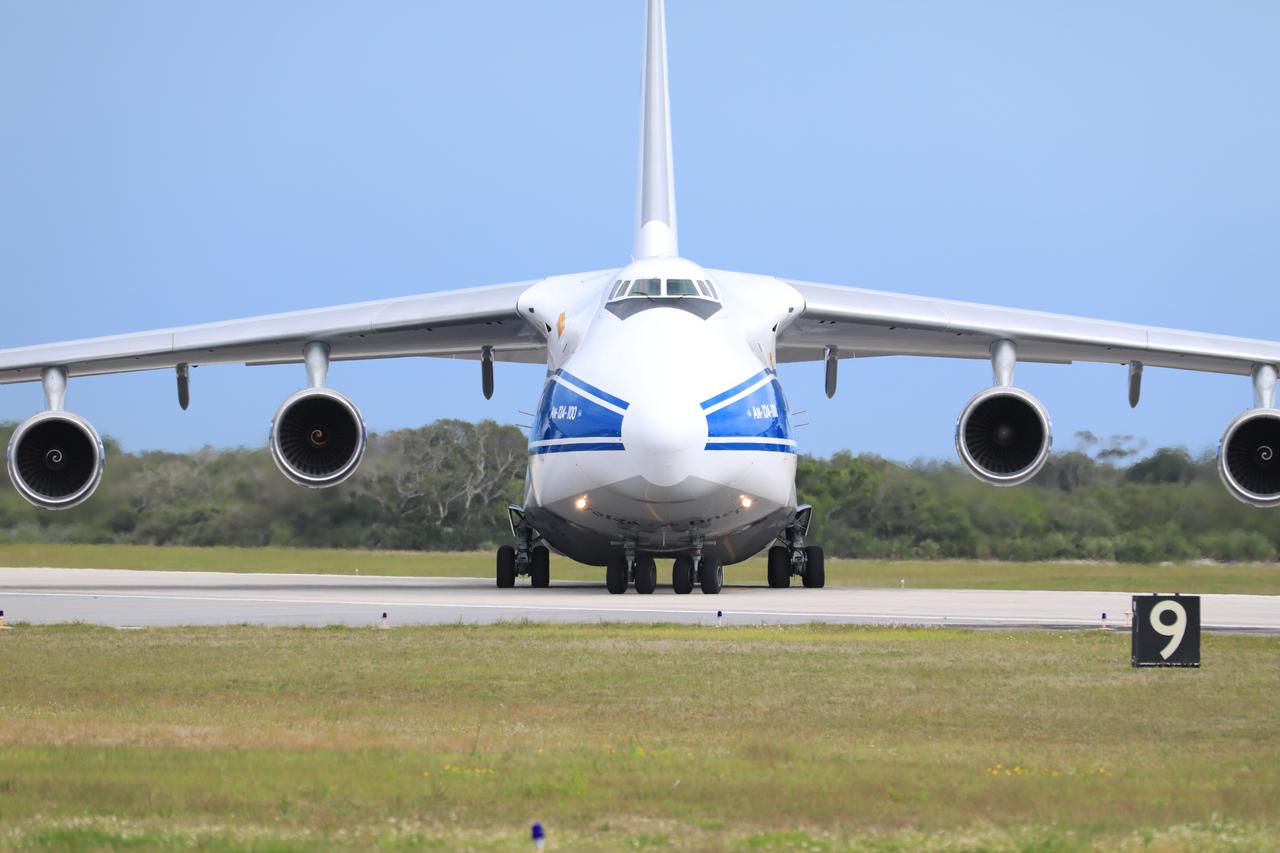 The Antonov 124 cargo aircraft, carrying the United Launch Alliance booster for NASA’s Mars Perseverance rover, taxis off the runway at the Skid Strip at Cape Canaveral Air Force Station (CCAFS) in Florida on May 18, 2020. The Mars Perseverance rover is scheduled to launch in mid-July atop a United Launch Alliance Atlas V 541 rocket from Pad 41 at CCAFS. The rover is part of NASA’s Mars Exploration Program, a long-term effort of robotic exploration of the Red Planet. The rover will search for habitable conditions in the ancient past and signs of past microbial life on Mars. The Launch Services Program at Kennedy is responsible for launch management.
