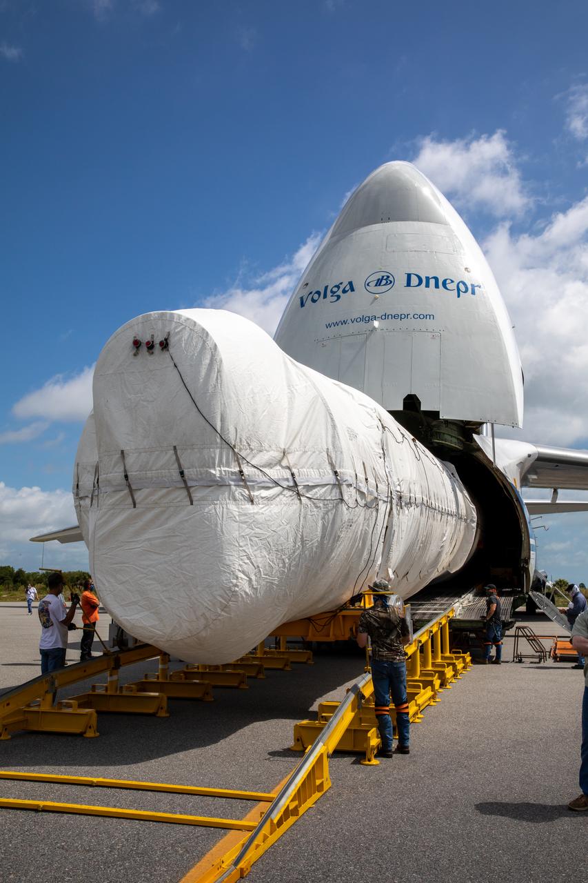 The United Launch Alliance booster for NASA’s Mars Perseverance rover is offloaded from the Antonov 124 cargo aircraft at the Skid Strip at Cape Canaveral Air Force Station (CCAFS) in Florida on May 19, 2020. The Mars Perseverance rover is scheduled to launch in mid-July atop a United Launch Alliance Atlas V 541 rocket from Pad 41 at CCAFS. The rover is part of NASA’s Mars Exploration Program, a long-term effort of robotic exploration of the Red Planet. The rover will search for habitable conditions in the ancient past and signs of past microbial life on Mars. The Launch Services Program at Kennedy is responsible for launch management.