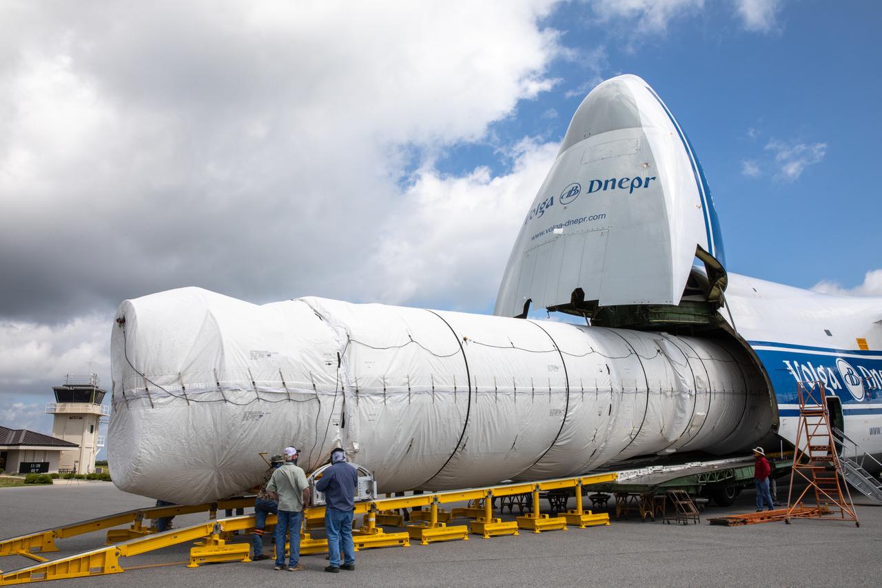 The United Launch Alliance booster for NASA’s Mars Perseverance rover is offloaded from the Antonov 124 cargo aircraft at the Skid Strip at Cape Canaveral Air Force Station (CCAFS) in Florida on May 19, 2020. The Mars Perseverance rover is scheduled to launch in mid-July atop a United Launch Alliance Atlas V 541 rocket from Pad 41 at CCAFS. The rover is part of NASA’s Mars Exploration Program, a long-term effort of robotic exploration of the Red Planet. The rover will search for habitable conditions in the ancient past and signs of past microbial life on Mars. The Launch Services Program at Kennedy is responsible for launch management.