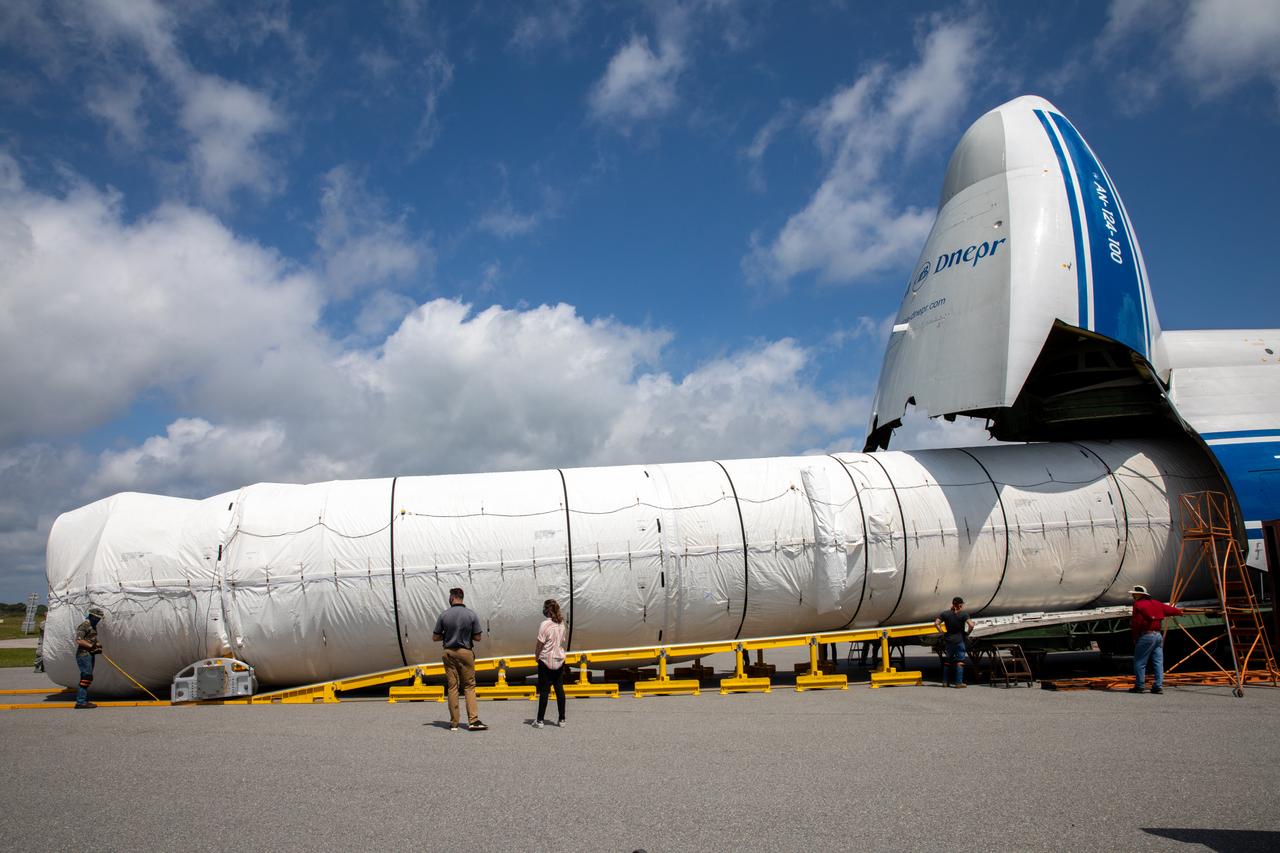 The United Launch Alliance booster for NASA’s Mars Perseverance rover is offloaded from the Antonov 124 cargo aircraft at the Skid Strip at Cape Canaveral Air Force Station (CCAFS) in Florida on May 19, 2020. The Mars Perseverance rover is scheduled to launch in mid-July atop a United Launch Alliance Atlas V 541 rocket from Pad 41 at CCAFS. The rover is part of NASA’s Mars Exploration Program, a long-term effort of robotic exploration of the Red Planet. The rover will search for habitable conditions in the ancient past and signs of past microbial life on Mars. The Launch Services Program at Kennedy is responsible for launch management.