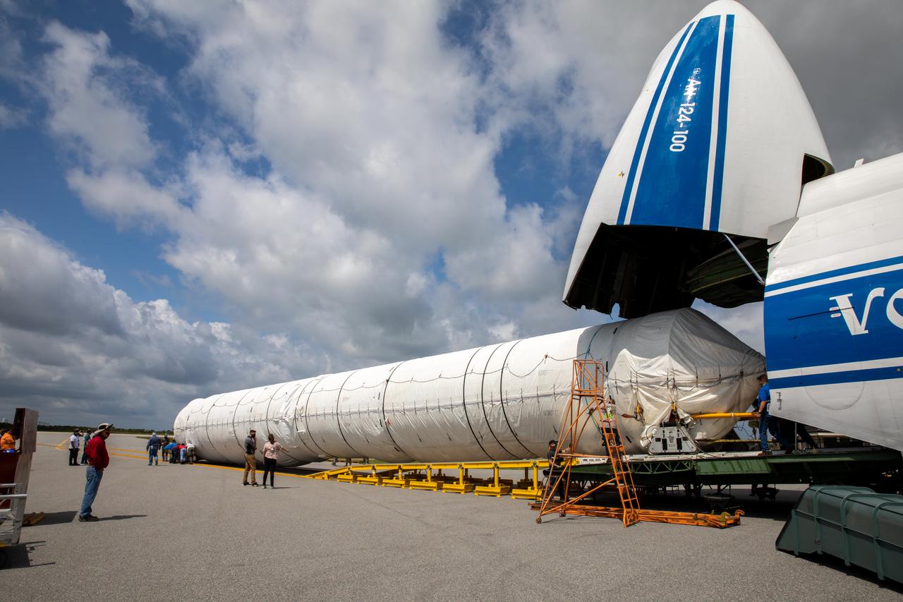 The United Launch Alliance booster for NASA’s Mars Perseverance rover is offloaded from the Antonov 124 cargo aircraft at the Skid Strip at Cape Canaveral Air Force Station (CCAFS) in Florida on May 19, 2020. The Mars Perseverance rover is scheduled to launch in mid-July atop a United Launch Alliance Atlas V 541 rocket from Pad 41 at CCAFS. The rover is part of NASA’s Mars Exploration Program, a long-term effort of robotic exploration of the Red Planet. The rover will search for habitable conditions in the ancient past and signs of past microbial life on Mars. The Launch Services Program at Kennedy is responsible for launch management.