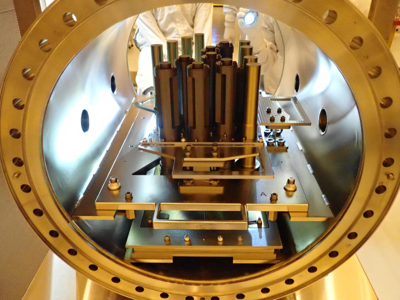 Inside the Payload Hazardous Servicing Facility at NASA’s Kennedy Space Center in Florida, the Sample Caching System Sterile Flight Model hardware is being prepared for installation on the Mars Perseverance rover on May 20, 2020. The system includes 39 sample tubes that will be inserted into the underside of the rover. Each tube is sheathed in a gold-colored cylindrical enclosure to protect it from contamination. Perseverance rover will carry 43 sample tubes in total to Mars' Jezero Crater. The Mars Perseverance rover is scheduled to launch in mid-July atop a United Launch Alliance Atlas V 541 rocket from Pad 41 at nearby Cape Canaveral Air Force Station. The rover is part of NASA’s Mars Exploration Program, a long-term effort of robotic exploration of the Red Planet. The rover will search for habitable conditions in the ancient past and signs of past microbial life on Mars. The Launch Services Program at Kennedy is responsible for launch management.