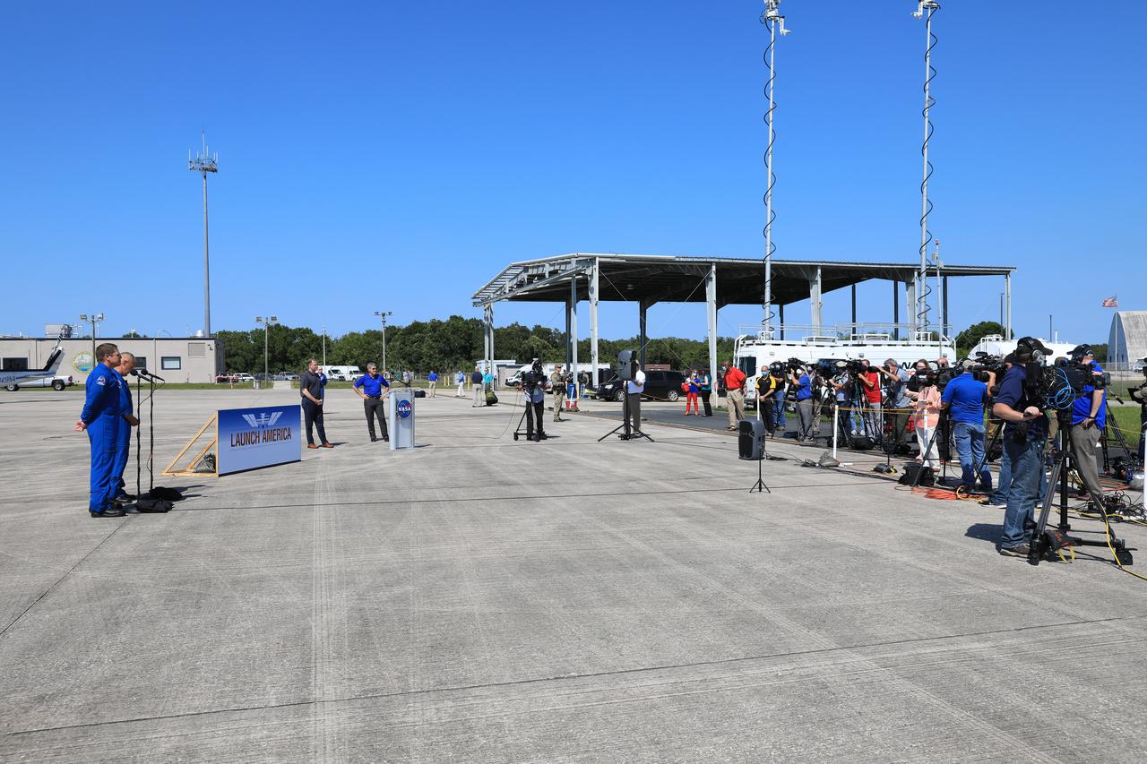 From left, Demo-2 crew members Robert Behnken and Douglas Hurley, NASA Administrator Jim Bridenstine and Kennedy Space Center Director Bob Cabana speak to members of the media on May 20, 2020, at the Launch and Landing Facility runway following the crew’s arrival to the Florida spaceport. Under NASA’s Commercial Crew Program, Behnken and Hurley will be the first astronauts launching to the International Space Station from U.S. soil since the end of the Space Shuttle Program in 2011. Liftoff of the SpaceX Falcon 9 rocket and Crew Dragon spacecraft is scheduled for 4:33 p.m. on May 27 from Kennedy’s Launch Complex 39A.