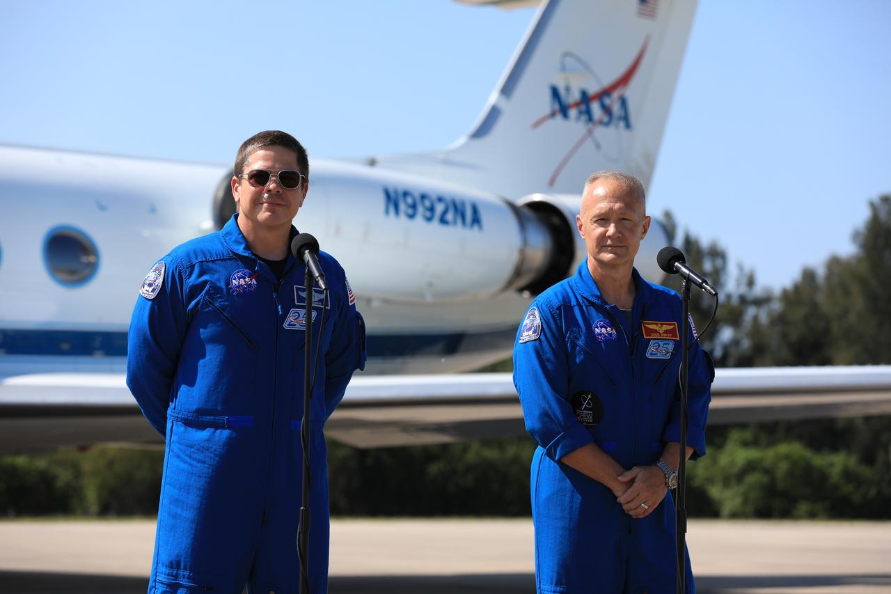 Demo-2 crew members Robert Behnken (left) and Douglas Hurley speak to members of the media at the Launch and Landing Facility runway following their arrival to NASA’s Kennedy Space Center in Florida from Houston, Texas. Under NASA’s Commercial Crew Program, Behnken and Hurley will be the first astronauts launching to the International Space Station from U.S. soil since the end of the Space Shuttle Program in 2011. Liftoff of the SpaceX Falcon 9 rocket and Crew Dragon spacecraft is scheduled for 4:33 p.m. on May 27 from Kennedy’s Launch Complex 39A.