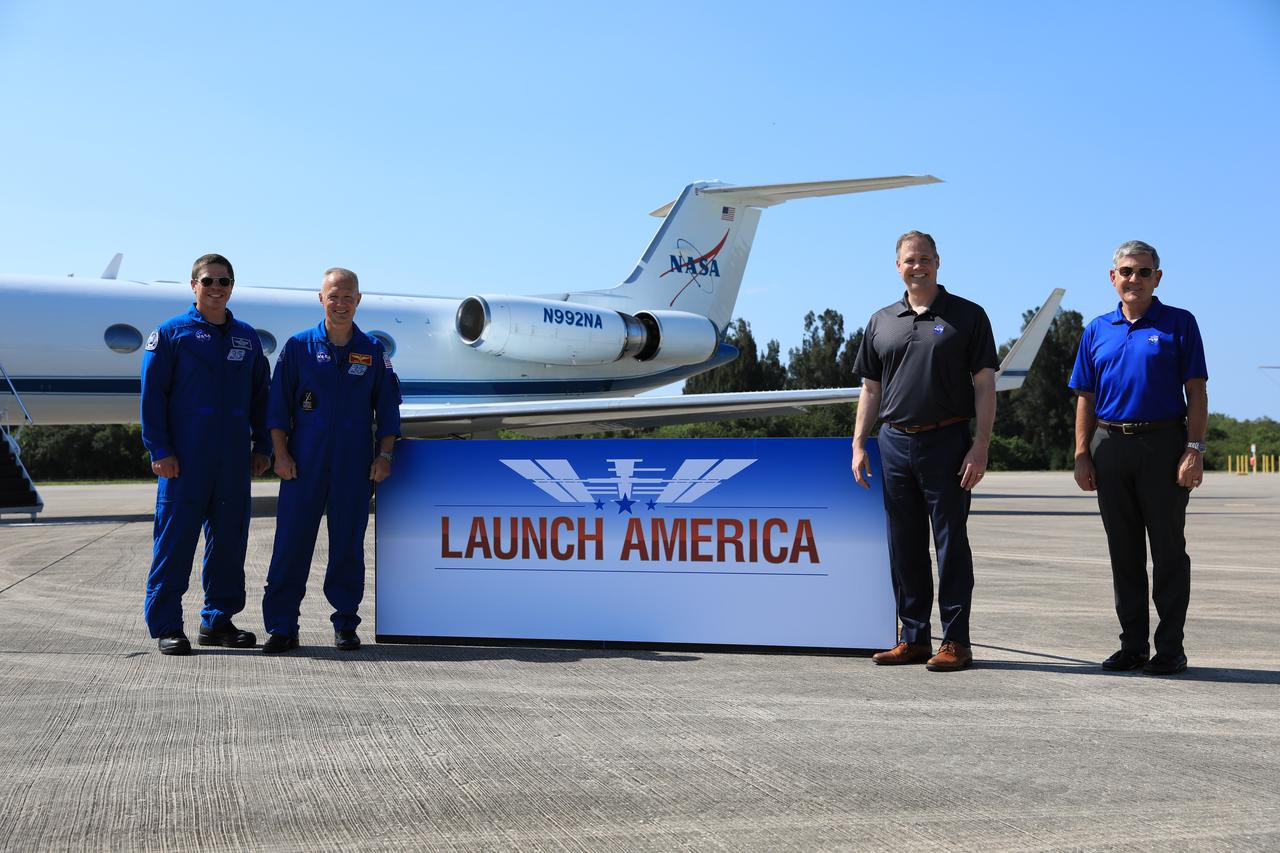 From left, Demo-2 crew members Robert Behnken and Douglas Hurley, NASA Administrator Jim Bridenstine and Kennedy Space Center Director Bob Cabana pose for a photo after speaking to members of the media on May 20, 2020, at the Launch and Landing Facility runway following the crew’s arrival to the Florida spaceport. Under NASA’s Commercial Crew Program, Behnken and Hurley will be the first astronauts launching to the International Space Station from U.S. soil since the end of the Space Shuttle Program in 2011. Liftoff of the SpaceX Falcon 9 rocket and Crew Dragon spacecraft is scheduled for 4:33 p.m. on May 27 from Kennedy’s Launch Complex 39A.