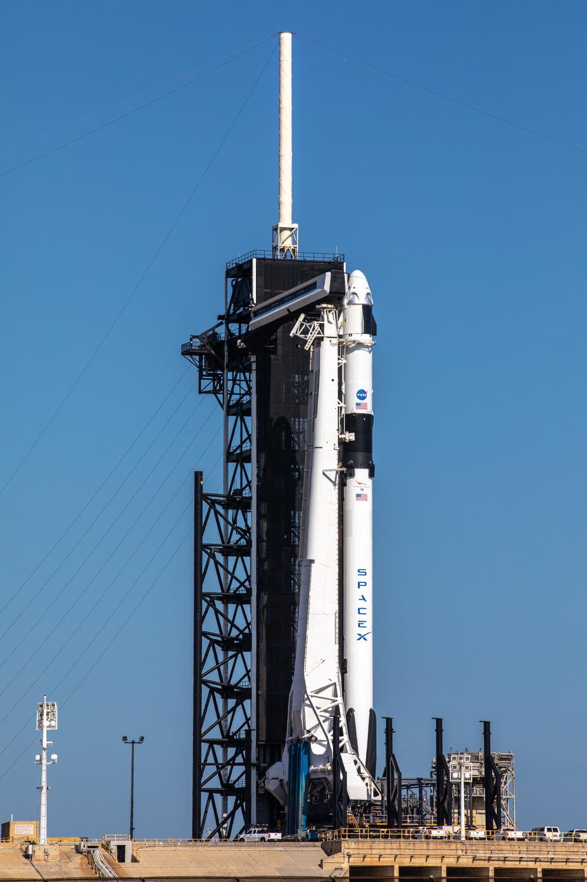 A SpaceX Falcon 9 rocket, with the Crew Dragon atop, stands poised for launch at historic Launch Complex 39A at NASA’s Kennedy Space Center in Florida on May 21, 2020, ahead of NASA’s SpaceX Demo-2 mission. The rocket and spacecraft will carry NASA astronauts Robert Behnken and Douglas Hurley to the International Space Station as part of the agency’s Commercial Crew Program, returning human spaceflight capability to the U.S. after nearly a decade. This will be SpaceX’s final flight test, paving the way for NASA to certify the crew transportation system for regular, crewed flights to the orbiting laboratory. Launch is slated for 4:33 p.m. EDT on Wednesday, May 27.
