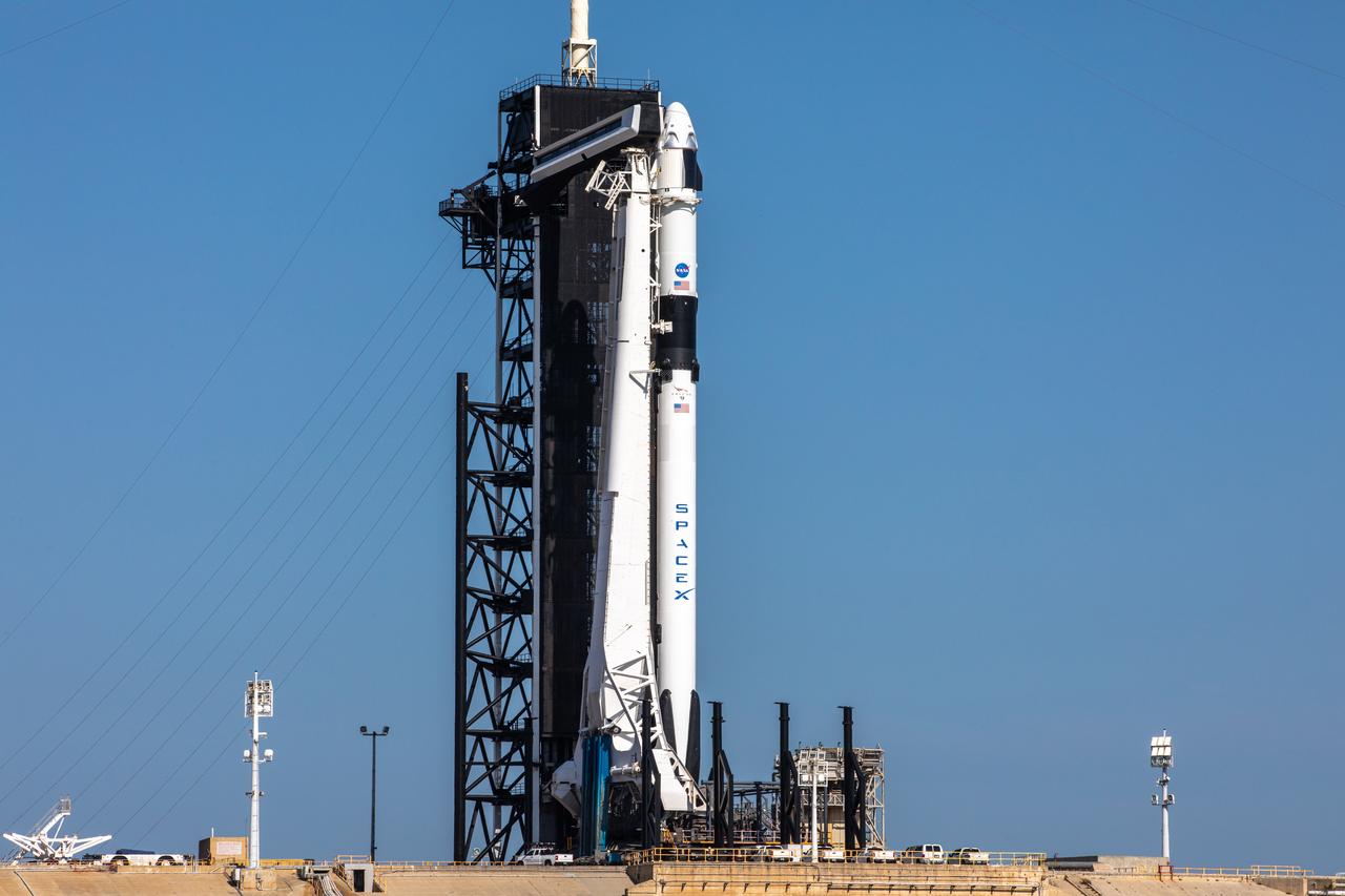 A SpaceX Falcon 9 rocket, with the Crew Dragon atop, stands poised for launch at historic Launch Complex 39A at NASA’s Kennedy Space Center in Florida on May 21, 2020, ahead of NASA’s SpaceX Demo-2 mission. The rocket and spacecraft will carry NASA astronauts Robert Behnken and Douglas Hurley to the International Space Station as part of the agency’s Commercial Crew Program, returning human spaceflight capability to the U.S. after nearly a decade. This will be SpaceX’s final flight test, paving the way for NASA to certify the crew transportation system for regular, crewed flights to the orbiting laboratory. Launch is slated for 4:33 p.m. EDT on Wednesday, May 27.