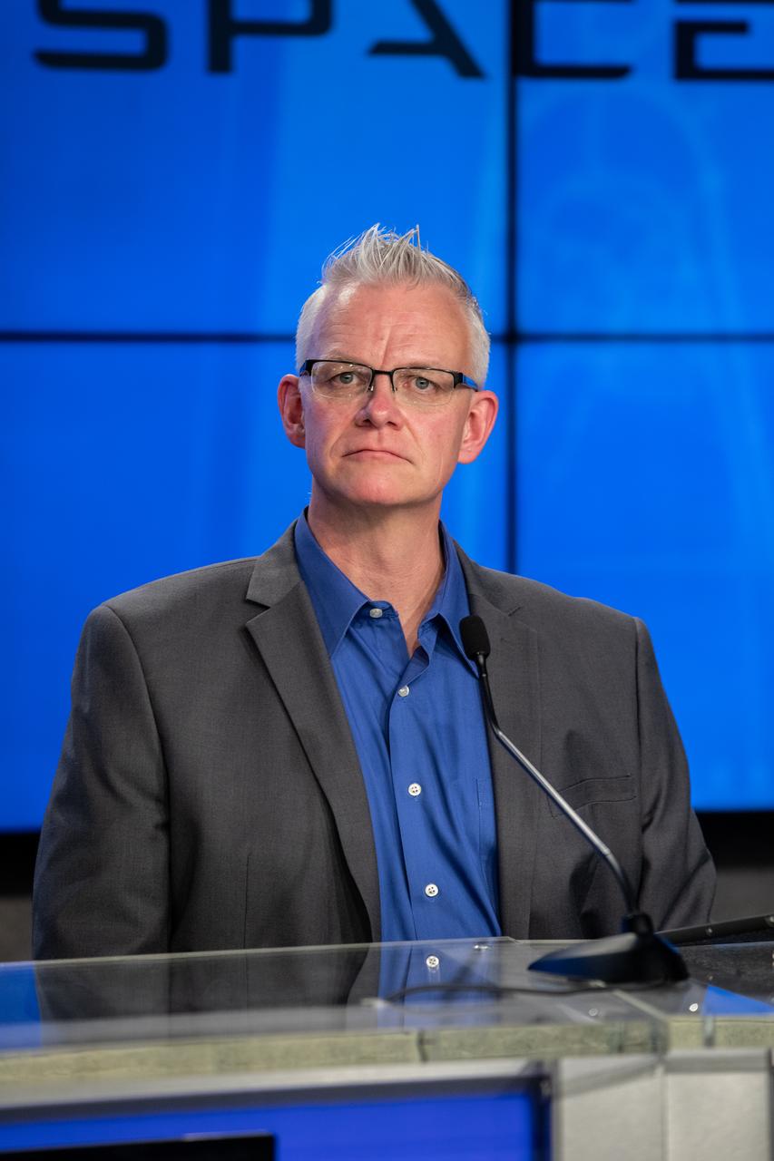 Benji Reed, director of Crew Mission Management at SpaceX, participates in a news briefing inside the Press Site auditorium at NASA’s Kennedy Space Center in Florida on May 22, 2020, following the conclusion of the flight readiness review for the agency’s SpaceX Demo-2 mission, with NASA astronauts Robert Behnken and Douglas Hurley, to the International Space Station. This will be SpaceX’s final flight test for NASA’s Commercial Crew Program. Behnken and Hurley will fly to the orbiting laboratory in a SpaceX Crew Dragon spacecraft, launching atop a Falcon 9 rocket from Kennedy’s Launch Complex 39A. Liftoff is scheduled for 4:33 p.m. EDT on Wednesday, May 27.