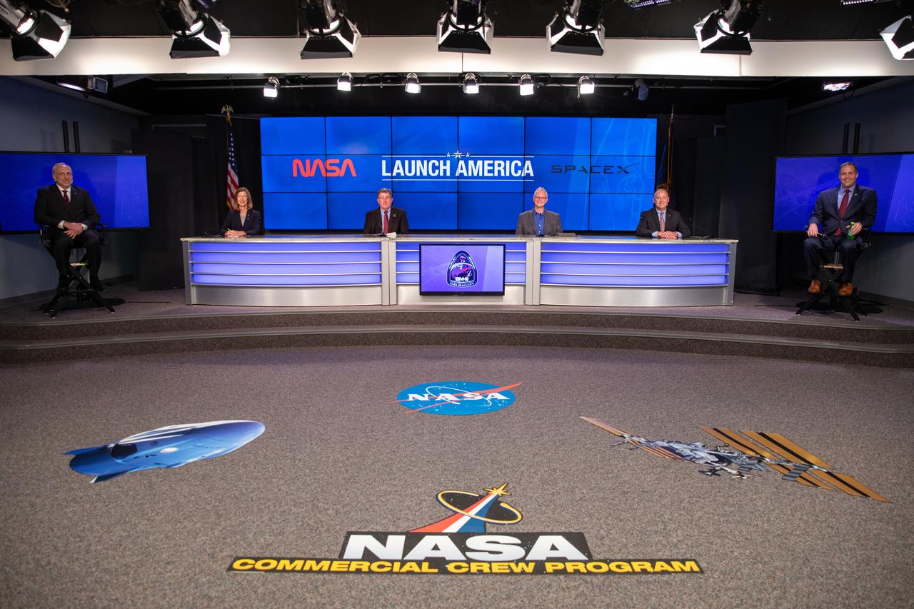 Inside the Press Site auditorium at NASA’s Kennedy Space Center in Florida, agency and industry leaders conduct a virtual news conference with members of the media on May 22, 2020, following the conclusion of the flight readiness review for NASA’s SpaceX Demo-2 mission, with NASA astronauts Robert Behnken and Douglas Hurley, to the International Space Station. From left are Steve Jurczyk, NASA associate administrator; Kathy Lueders, Commercial Crew Program manager; Kirk Shireman, International Space Station Program manager; Benji Reed, director of Crew Mission Management, SpaceX; Norm Knight, deputy director of NASA’s Johnson Space Center’s Flight Operations; and Jim Bridenstine, NASA administrator. This will be SpaceX’s final flight test for NASA’s Commercial Crew Program. Behnken and Hurley will fly to the orbiting laboratory in a SpaceX Crew Dragon spacecraft, launching atop a Falcon 9 rocket from Kennedy’s Launch Complex 39A. Liftoff is scheduled for 4:33 p.m. EDT on Wednesday, May 27.