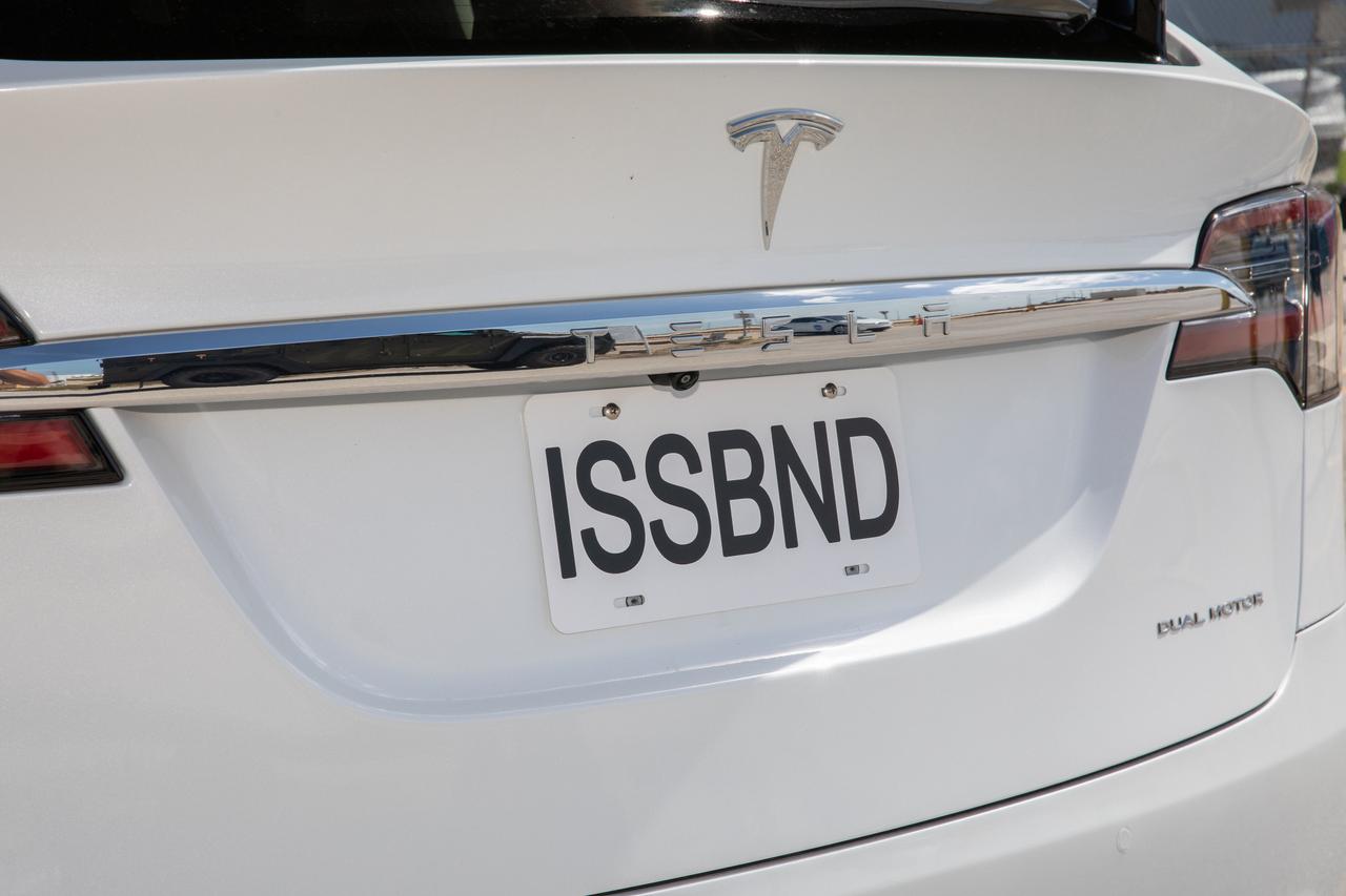 A Tesla with a tag that reads “ISSBND” is photographed at historic Launch Complex 39A during a dress rehearsal for launch at NASA’s Kennedy Space Center in Florida on May 23, 2020, ahead of the agency’s SpaceX Demo-2 mission to the International Space Station. The Tesla will take Demo-2 crew members Robert Behnken and Douglas Hurley from the Neil A. Armstrong Operations and Checkout Building to the launch pad on launch day. Demo-2 will serve as an end-to-end flight test of SpaceX’s crew transportation system, providing valuable data toward NASA certifying the system for regular, crewed missions to the orbiting laboratory under the agency’s Commercial Crew Program. Liftoff is targeted for 4:33 p.m. EDT on Wednesday, May 27.