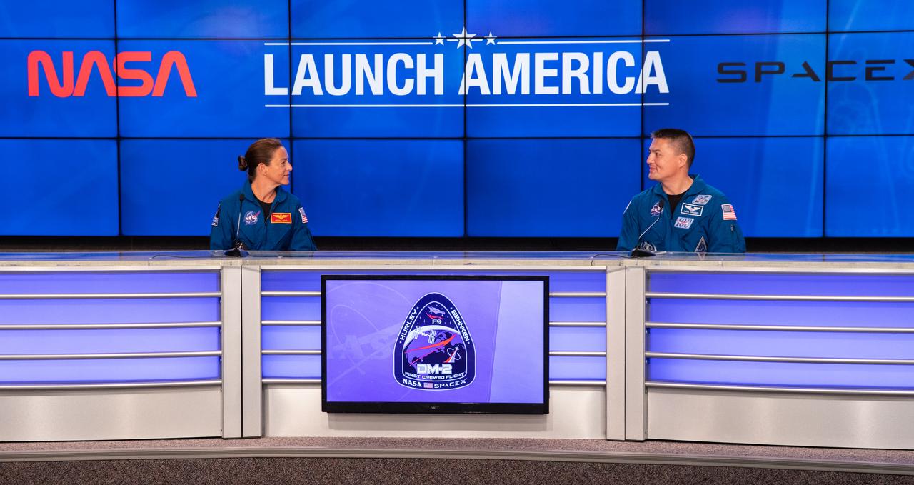 NASA astronauts Nicole Mann (left) and Kjell Lindgren participate in a press briefing inside the Press Site auditorium on May 26, 2020, at the agency’s Kennedy Space Center in Florida ahead of NASA’s SpaceX Demo-2 launch, slated for Wednesday, May 27. A SpaceX Falcon 9 rocket and Crew Dragon spacecraft are scheduled to lift off from Kennedy’s Launch Complex 39A, carrying NASA astronauts Robert Behnken and Douglas Hurley to the International Space Station. This will mark the first launch of astronauts from U.S. soil to the space station since the conclusion of the Space Shuttle Program in 2011. Part of the agency’s Commercial Crew Program, this will be SpaceX’s final flight test, paving the way for NASA to certify the crew transportation system for regular, crewed flights to the orbiting laboratory. Liftoff is scheduled for 4:33 p.m. EDT.