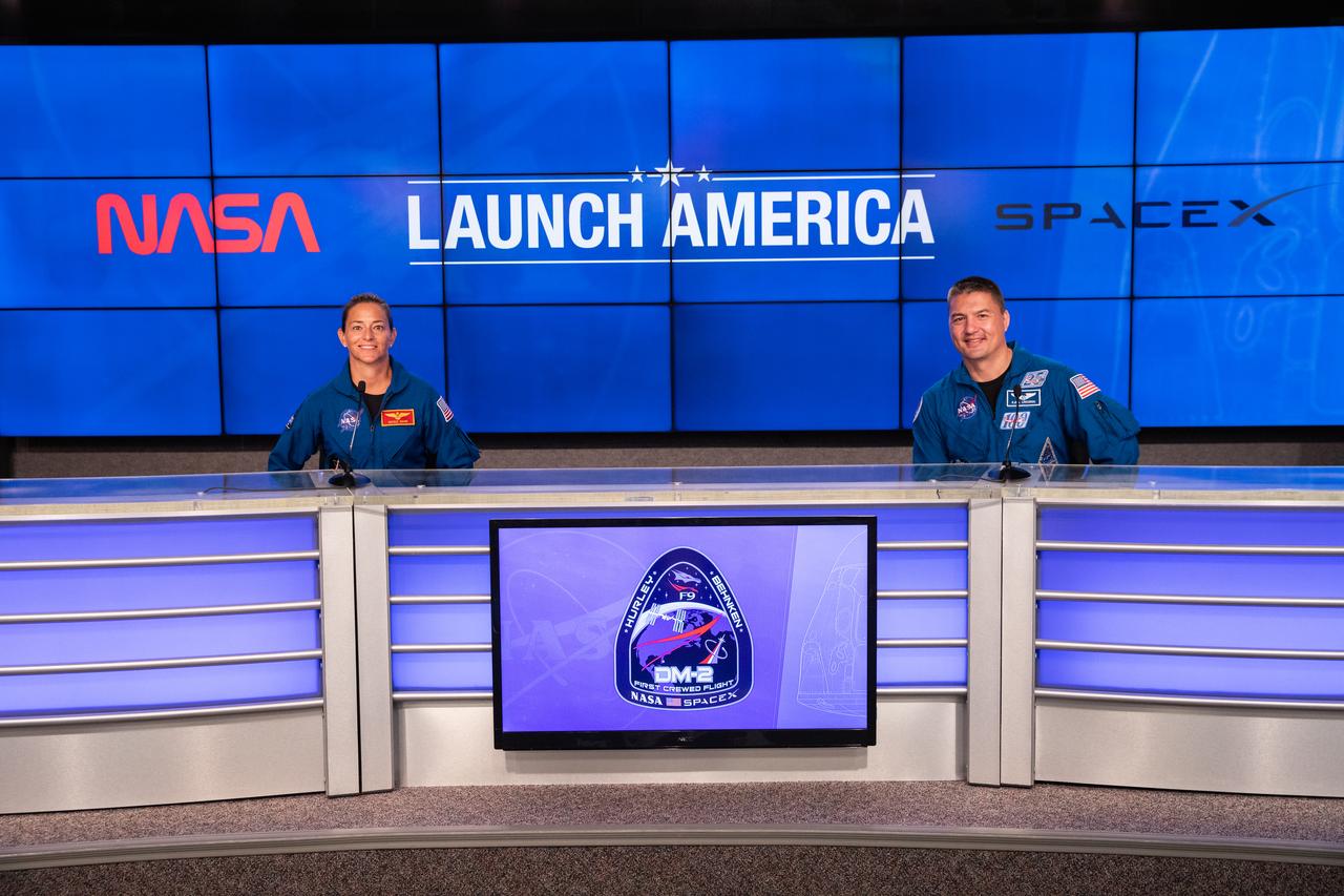 NASA astronauts Nicole Mann (left) and Kjell Lindgren participate in a press briefing inside the Press Site auditorium on May 26, 2020, at the agency’s Kennedy Space Center in Florida ahead of NASA’s SpaceX Demo-2 launch, slated for Wednesday, May 27. A SpaceX Falcon 9 rocket and Crew Dragon spacecraft are scheduled to lift off from Kennedy’s Launch Complex 39A, carrying NASA astronauts Robert Behnken and Douglas Hurley to the International Space Station. This will mark the first launch of astronauts from U.S. soil to the space station since the conclusion of the Space Shuttle Program in 2011. Part of the agency’s Commercial Crew Program, this will be SpaceX’s final flight test, paving the way for NASA to certify the crew transportation system for regular, crewed flights to the orbiting laboratory. Liftoff is scheduled for 4:33 p.m. EDT.