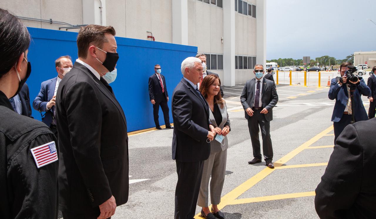 From left, SpaceX CEO and Chief Designer Elon Musk, Vice President Mike Pence and second lady Karen Pence pose for a photo outside of the Neil A. Armstrong Operations and Checkout Building at NASA’s Kennedy Space Center in Florida ahead of the agency’s SpaceX Demo-2 launch. The launch, initially scheduled for May 27, 2020, was scrubbed due to unfavorable weather conditions around Launch Complex 39A. The next launch attempt will be Saturday, May 30. Liftoff of the SpaceX Falcon 9 rocket and Crew Dragon spacecraft is scheduled for 3:22 p.m. EDT from historic Launch Complex 39A. Behnken and Hurley will be the first astronauts to launch to the International Space Station from U.S. soil since the end of the Space Shuttle Program in 2011. Part of NASA’s Commercial Crew Program, this will be SpaceX’s final flight test, paving the way for the agency to certify the crew transportation system for regular, crewed flights to the orbiting laboratory.