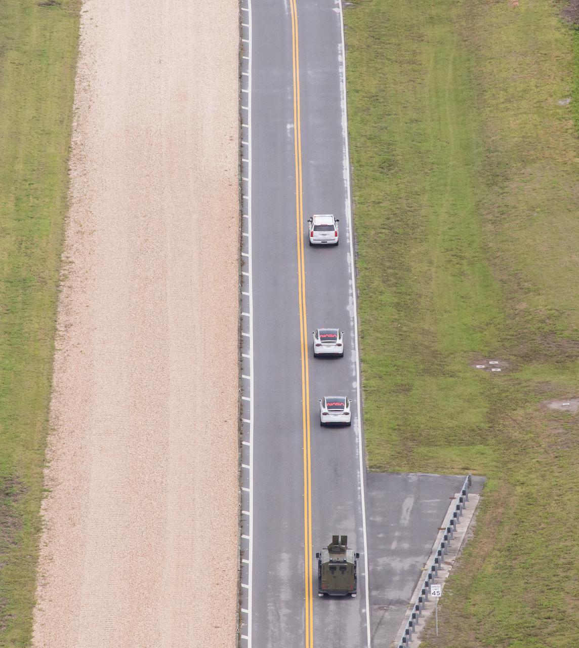 NASA astronauts Robert Behnken and Douglas Hurley make the journey from the Neil A. Armstrong Operations and Checkout Building to historic Launch Complex 39A at the agency’s Kennedy Space Center in Florida as they prepare to embark on NASA’s SpaceX Demo-2 mission. The astronauts are being transported to the launch pad in a Tesla Model X. The launch, initially scheduled for May 27, 2020, was scrubbed due to unfavorable weather conditions around Launch Complex 39A. The next launch attempt will be Saturday, May 30. Liftoff of the SpaceX Falcon 9 rocket and Crew Dragon spacecraft is scheduled for 3:22 p.m. EDT from Launch Complex 39A. Behnken and Hurley will be the first astronauts to launch to the International Space Station from U.S. soil since the end of the Space Shuttle Program in 2011. Part of NASA’s Commercial Crew Program, this will be SpaceX’s final flight test, paving the way for the agency to certify the crew transportation system for regular, crewed flights to the orbiting laboratory.