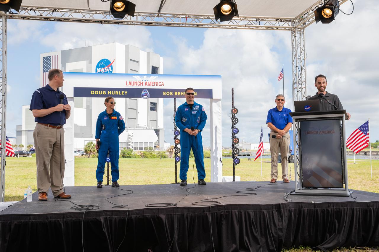 Joshua Santora, far right, with NASA Communications, moderates a NASA Social YouTube Live briefing May 29, 2020, near the Press Site countdown clock at the agency’s Kennedy Space Center in Florida ahead of NASA’s SpaceX Demo-2 launch. From left, participants include NASA Administrator Jim Bridenstine, NASA astronauts Nicole Mann and Kjell Lindgren, and Kennedy Space Center Director Bob Cabana. The launch, initially scheduled for May 27, was scrubbed due to unfavorable weather conditions. The next launch attempt is Saturday, May 30. A SpaceX Falcon 9 rocket and Crew Dragon spacecraft are scheduled to lift off from Kennedy’s Launch Complex 39A, carrying NASA astronauts Robert Behnken and Douglas Hurley to the International Space Station. This will mark the first launch of astronauts from U.S. soil to the space station since the conclusion of the Space Shuttle Program in 2011. Part of the agency’s Commercial Crew Program, this will be SpaceX’s final flight test, paving the way for NASA to certify the crew transportation system for regular, crewed flights to the orbiting laboratory. Liftoff is scheduled for 3:22 p.m. EDT.