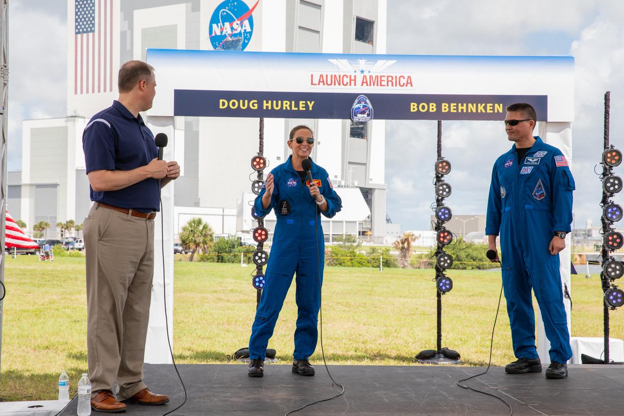 From left, NASA Administrator Jim Bridenstine and NASA astronauts Nicole Mann and Kjell Lindgren participate in a NASA Social YouTube Live briefing May 29, 2020, near the Press Site countdown clock at the agency’s Kennedy Space Center in Florida ahead of NASA’s SpaceX Demo-2 launch. The launch, initially scheduled for May 27, was scrubbed due to unfavorable weather conditions. The next launch attempt is Saturday, May 30. A SpaceX Falcon 9 rocket and Crew Dragon spacecraft are scheduled to lift off from Kennedy’s Launch Complex 39A, carrying NASA astronauts Robert Behnken and Douglas Hurley to the International Space Station. This will mark the first launch of astronauts from U.S. soil to the space station since the conclusion of the Space Shuttle Program in 2011. Part of the agency’s Commercial Crew Program, this will be SpaceX’s final flight test, paving the way for NASA to certify the crew transportation system for regular, crewed flights to the orbiting laboratory. Liftoff is scheduled for 3:22 p.m. EDT.