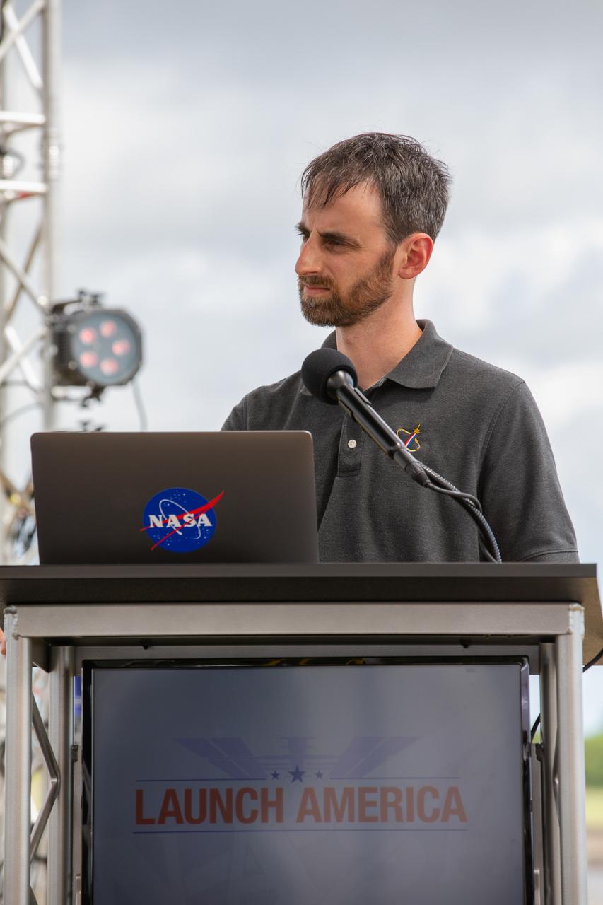 Joshua Santora, with NASA Communications, participates in a NASA Social YouTube Live briefing May 29, 2020, near the Press Site countdown clock at the agency’s Kennedy Space Center in Florida ahead of NASA’s SpaceX Demo-2 launch. The launch, initially scheduled for May 27, was scrubbed due to unfavorable weather conditions. The next launch attempt is Saturday, May 30. A SpaceX Falcon 9 rocket and Crew Dragon spacecraft are scheduled to lift off from Kennedy’s Launch Complex 39A, carrying NASA astronauts Robert Behnken and Douglas Hurley to the International Space Station. This will mark the first launch of astronauts from U.S. soil to the space station since the conclusion of the Space Shuttle Program in 2011. Part of the agency’s Commercial Crew Program, this will be SpaceX’s final flight test, paving the way for NASA to certify the crew transportation system for regular, crewed flights to the orbiting laboratory. Liftoff is scheduled for 3:22 p.m. EDT.