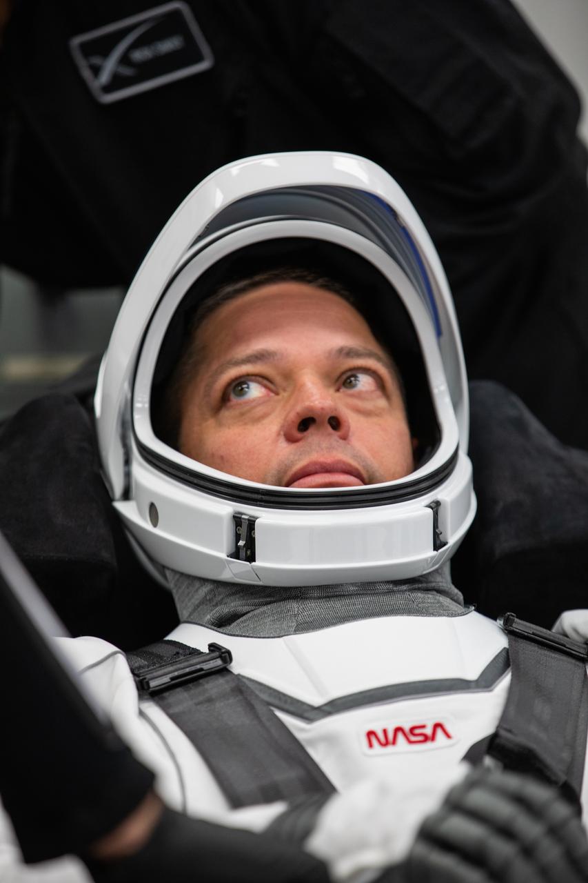Inside the suit-up room in the Neil A. Armstrong Operations and Checkout Building at NASA’s Kennedy Space Center in Florida, NASA astronaut Robert Behnken dons his spacesuit ahead of the agency’s SpaceX Demo-2 launch on May 30, 2020. Behnken and crewmate Douglas Hurley are the first astronauts to launch to the International Space Station from U.S. soil since the end of the Space Shuttle Program in 2011. The SpaceX Falcon 9 rocket and Crew Dragon spacecraft lifted off at 3:22 p.m. EDT from historic Launch Complex 39A. Part of NASA’s Commercial Crew Program, this will be SpaceX’s final flight test, paving the way for the agency to certify the crew transportation system for regular, crewed flights to the orbiting laboratory.