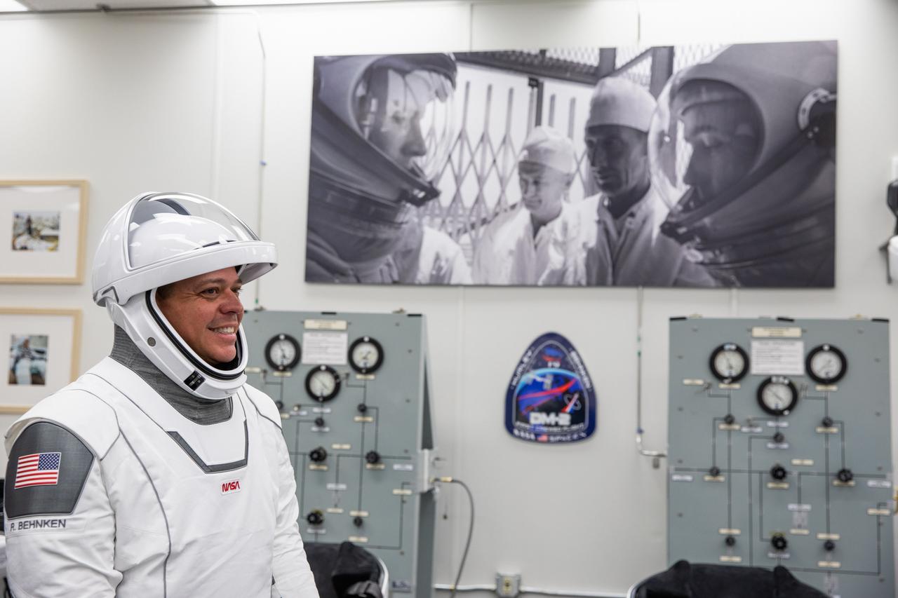 Inside the suit-up room in the Neil A. Armstrong Operations and Checkout Building at NASA’s Kennedy Space Center in Florida, NASA astronaut Robert Behnken dons his spacesuit ahead of the agency’s SpaceX Demo-2 launch on May 30, 2020. Behnken and crewmate Douglas Hurley are the first astronauts to launch to the International Space Station from U.S. soil since the end of the Space Shuttle Program in 2011. The SpaceX Falcon 9 rocket and Crew Dragon spacecraft lifted off at 3:22 p.m. EDT from historic Launch Complex 39A. Part of NASA’s Commercial Crew Program, this will be SpaceX’s final flight test, paving the way for the agency to certify the crew transportation system for regular, crewed flights to the orbiting laboratory.