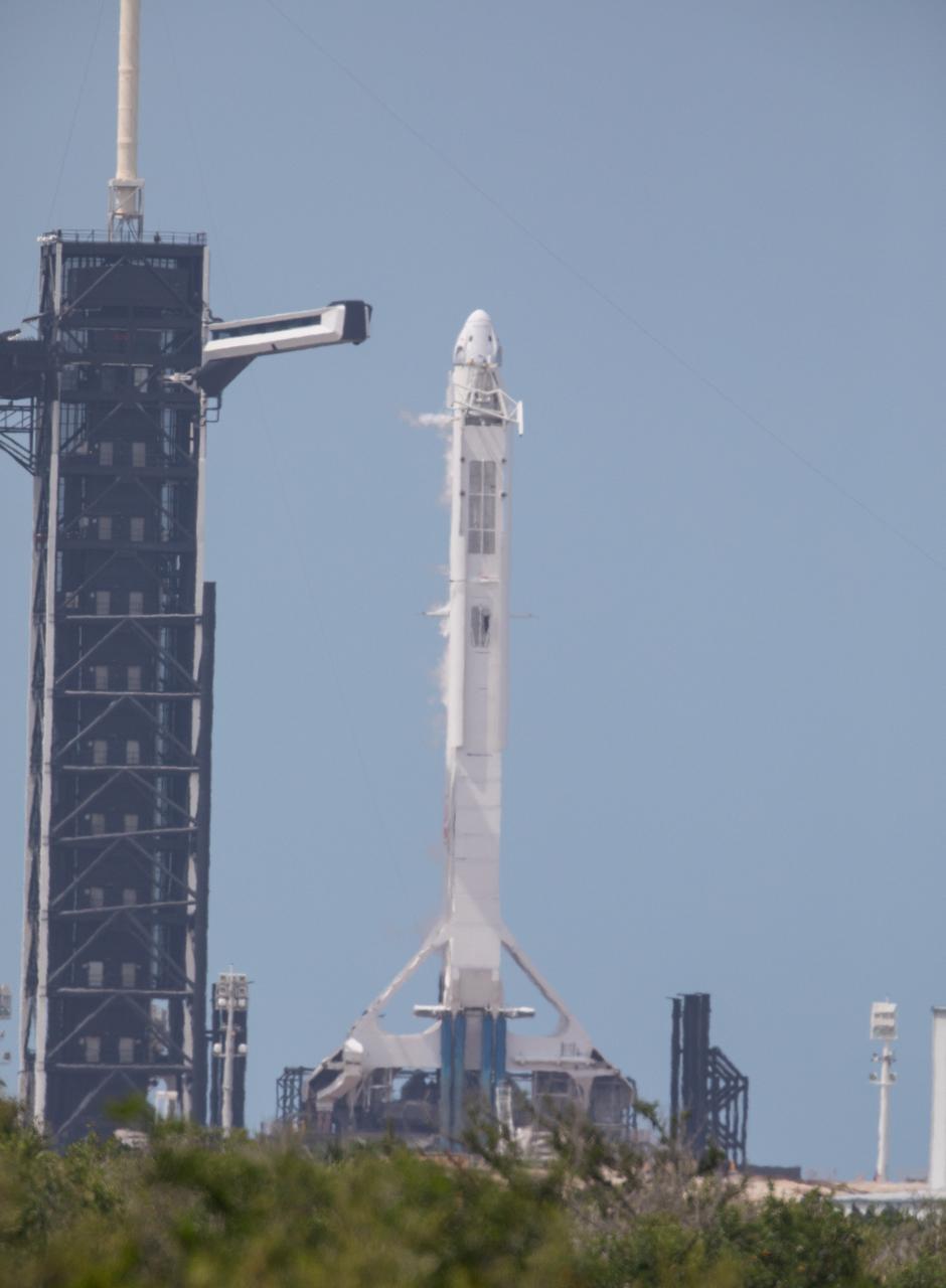 A SpaceX Falcon 9 rocket and Crew Dragon spacecraft stand poised for launch at historic Launch Complex 39A at NASA’s Kennedy Space Center in Florida on May 30, 2020, ahead of the agency’s SpaceX Demo-2 mission to the International Space Station. Liftoff occurred at 3:22 p.m. EDT. NASA astronauts Robert Behnken and Douglas Hurley are the first astronauts to launch from U.S. soil to the space station since the end of the Space Shuttle Program in 2011. Part of NASA’s Commercial Crew Program, this will be SpaceX’s final flight test, paving the way for the agency to certify the crew transportation system for regular, crewed flights to the orbiting laboratory.