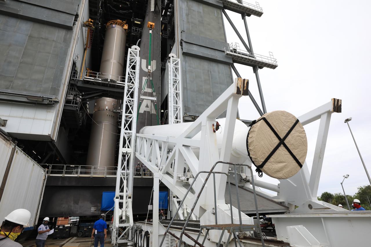 A lifting device is used to raise the second of four solid rocket boosters (SRB) for the United Launch Alliance Atlas V 541 rocket into the Vertical Integration Facility (VIF) at Space Launch Complex 41 at Cape Canaveral Air Force Station (CCAFS) in Florida on June 3, 2020. The SRB will be lifted up and mated to the Atlas V booster in the VIF. NASA’s Mars 2020 mission with the Perseverance rover is scheduled to launch on July 20, 2020, atop the Atlas V rocket from Pad 41. The rover is part of NASA’s Mars Exploration Program, a long-term effort of robotic exploration of the Red Planet. The rover’s seven instruments will search for habitable conditions in the ancient past and signs of past microbial life on Mars. The Launch Services Program at Kennedy is responsible for launch management.